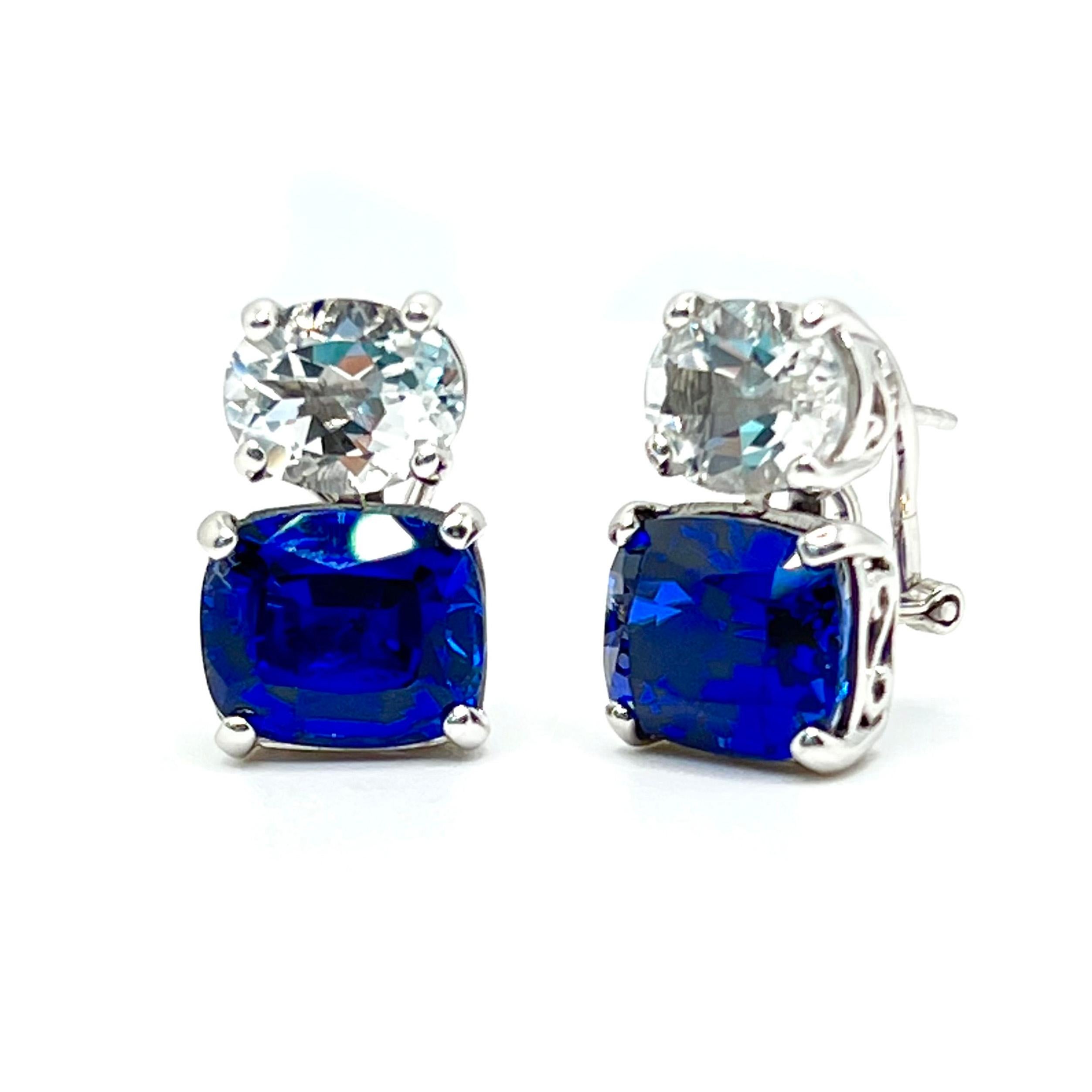 Stunning Oval White Topaz and Cushion-cut Lab Sapphire Earrings

These stunning pair of earrings features a pair of oval white topaz with cushion-cut lab-created blue sapphire, handset in platinum rhodium plated sterling silver.  Straight post with