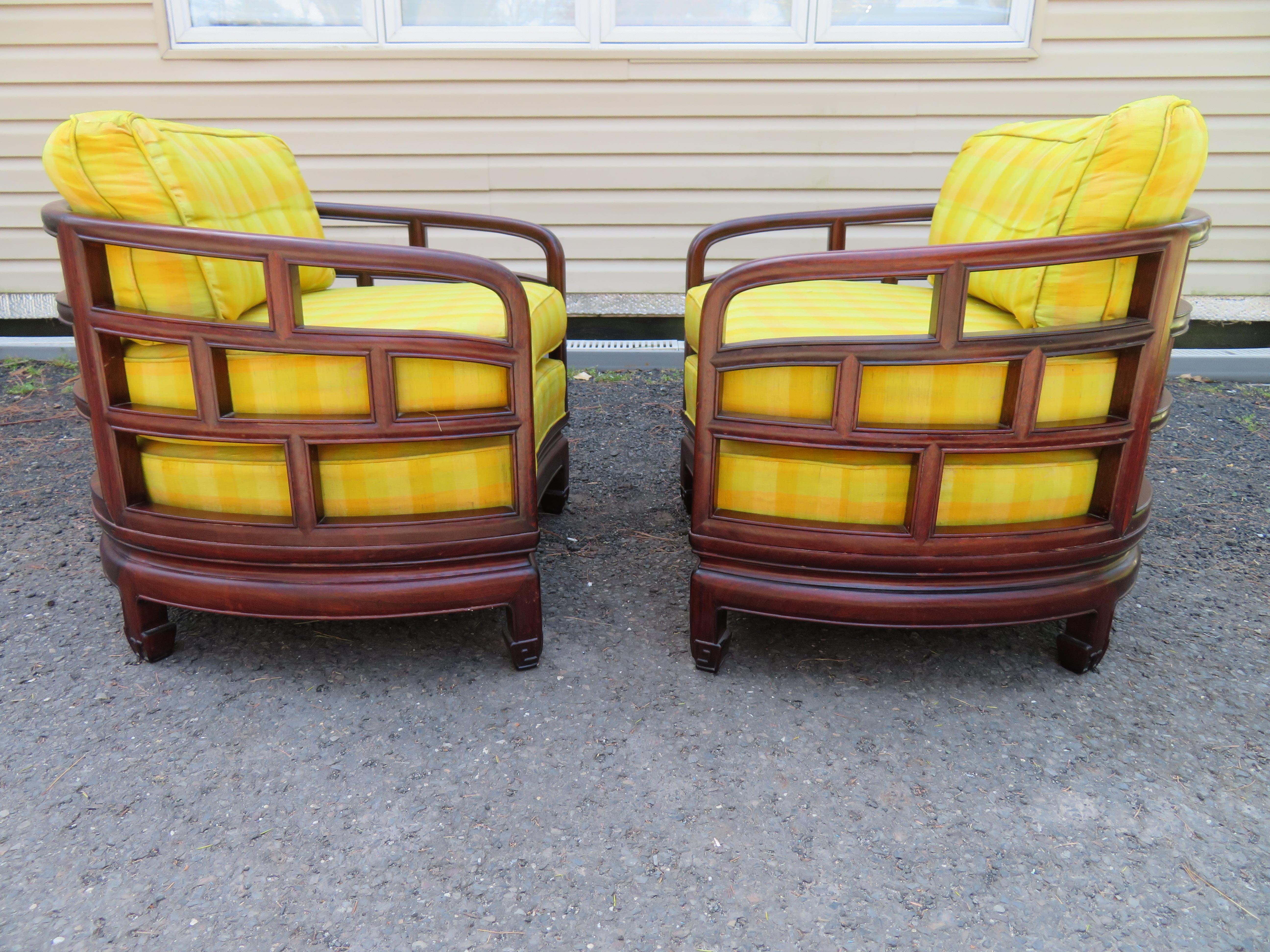 Stunning pair of barrel back Chinoiserie rosewood lounge chairs. These Fine chairs are upholstered in gorgeous yellow plaid taffeta fabric in usable vintage condition. We do have 2 pairs if multiples are needed- see the last photos to see the other