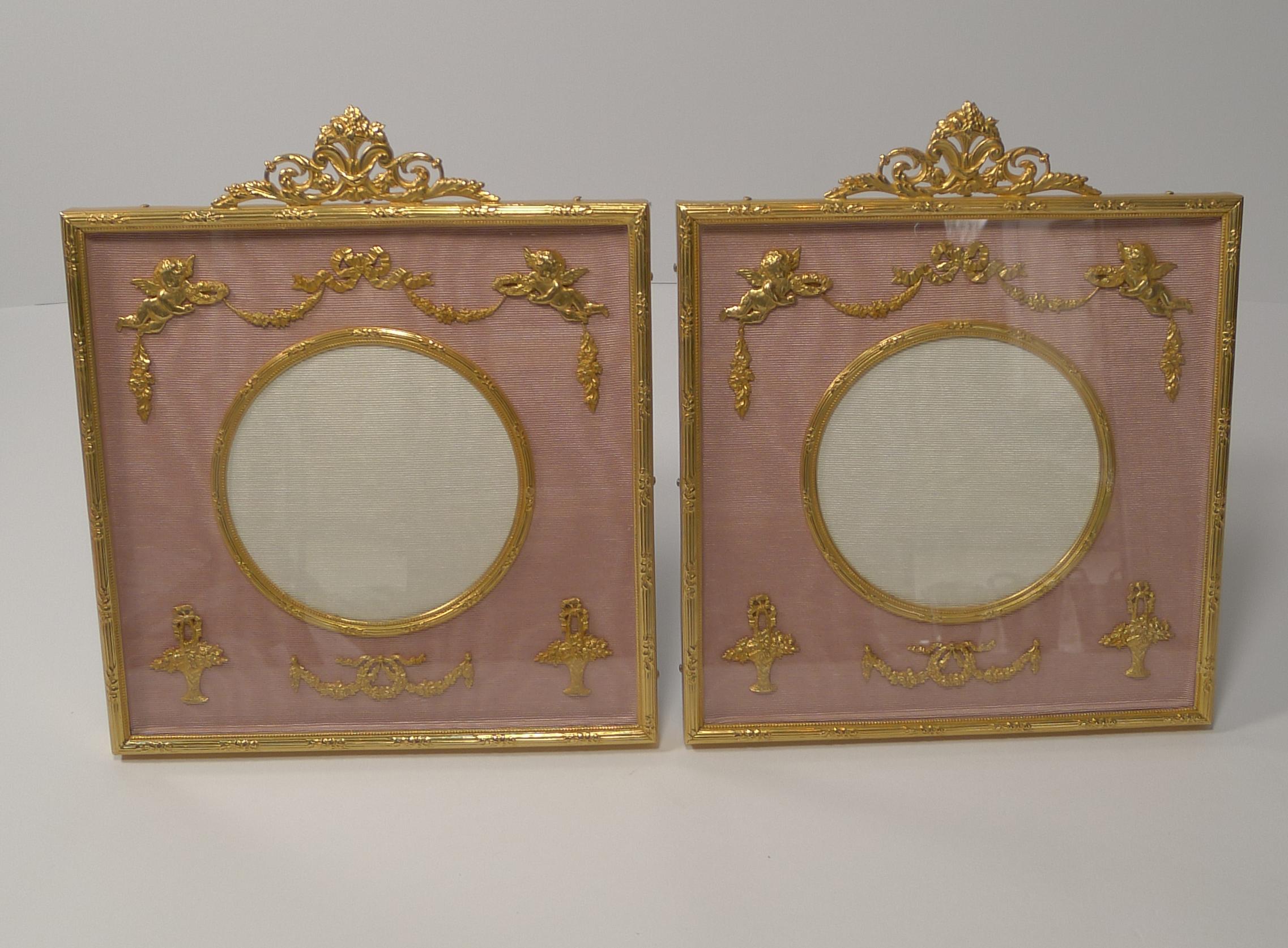 A stunning pair of antique French photograph frames made from Ormolu, bronze smothered in gold.

They have been professionally re-finished, restoring them to their former glory, dating to circa 1900.

Behind the glazed front, there are stunning