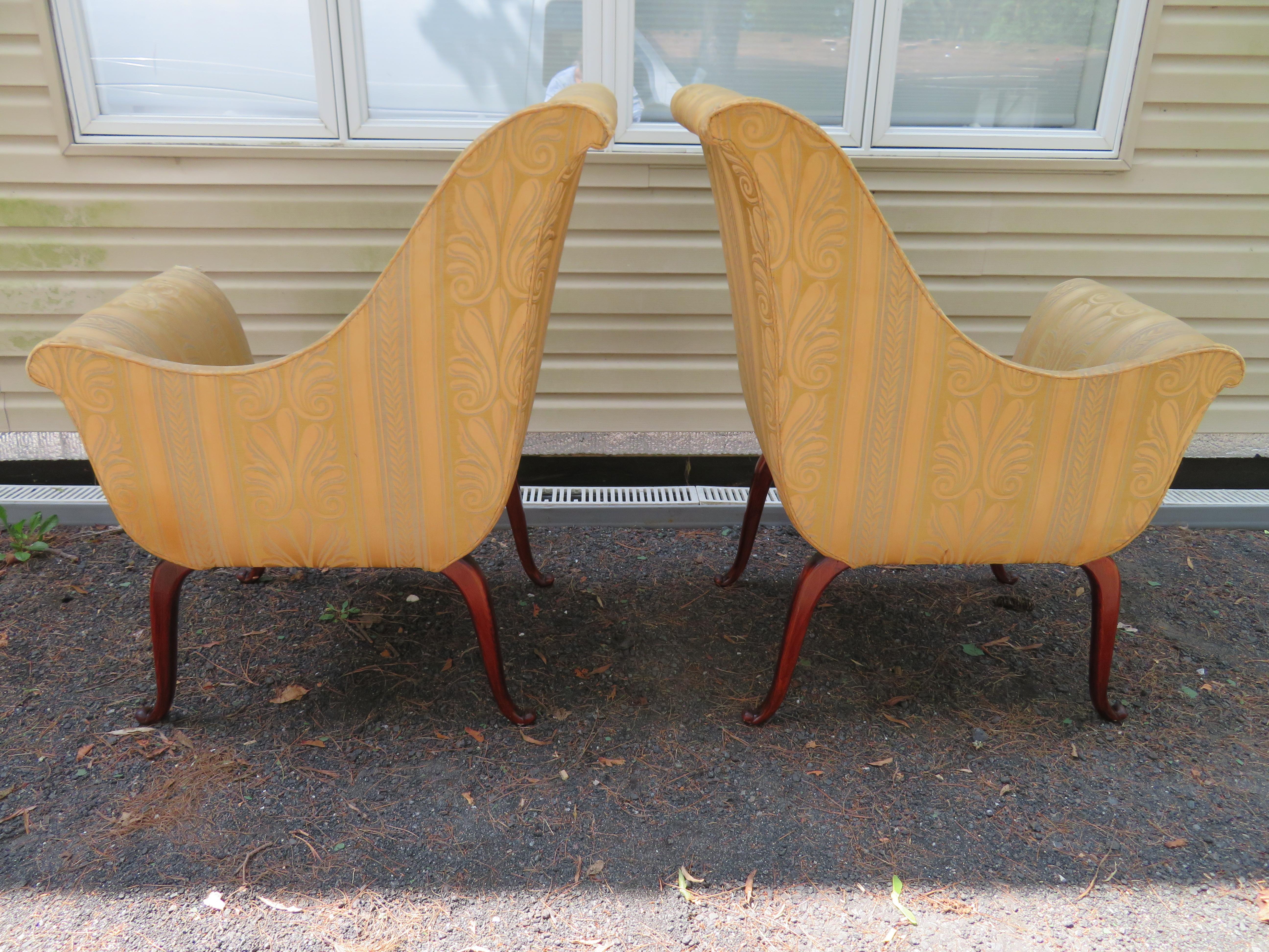 Stunning pair of Parler Deux Regency high low armchairs. These lovely chairs are well carved and very refined-original upholstery will need to be replaced.