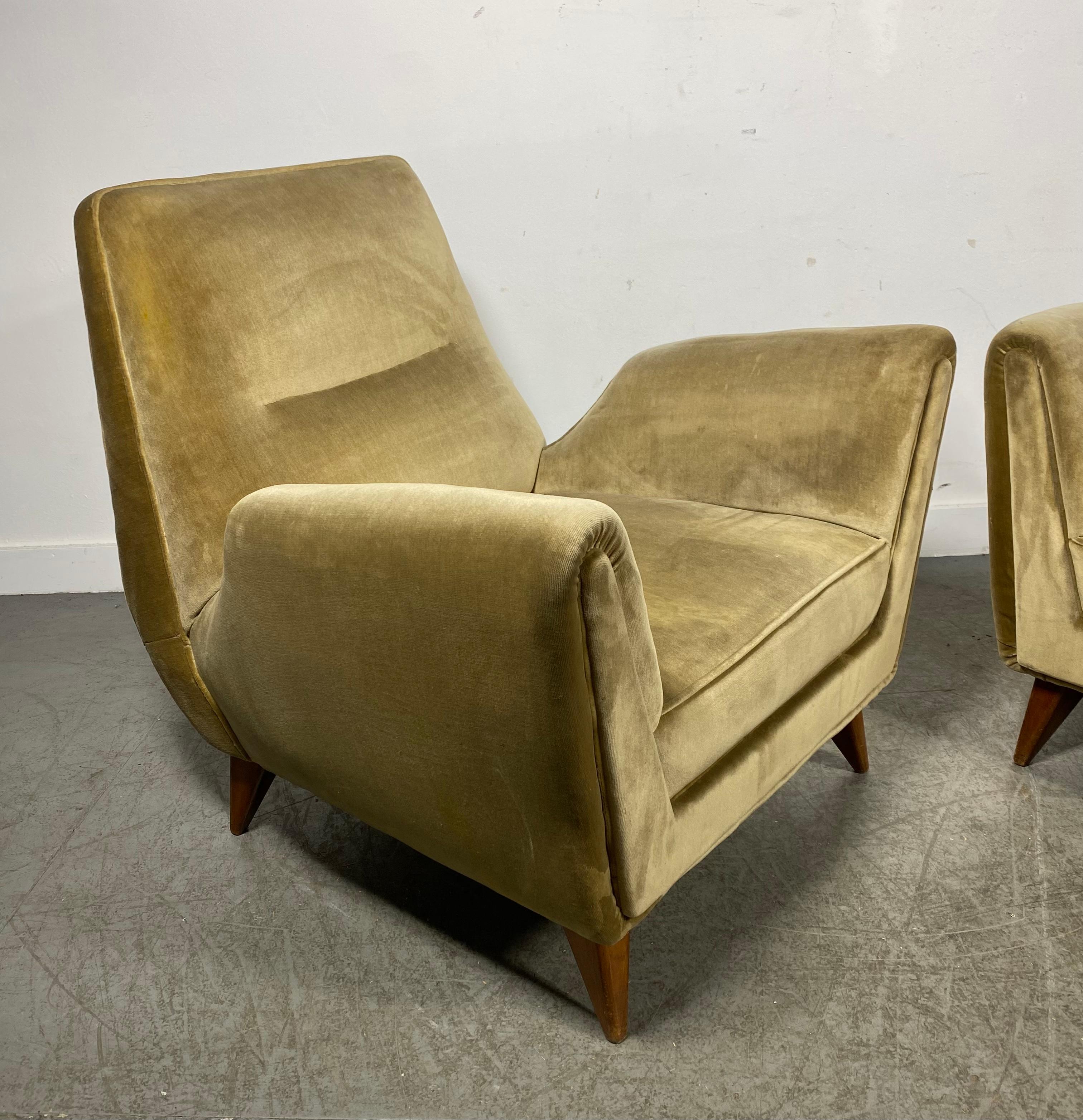 An Elegant and Timeless Pair of Italian Mid-Century Modern Lounge Chairs / Armchairs or Bed-side Chairs attributed to Gio Ponti and by ISA Bergamo. The chairs show a strong resemblance to other chairs that Gio Ponti designed for ISA Bergamo circa