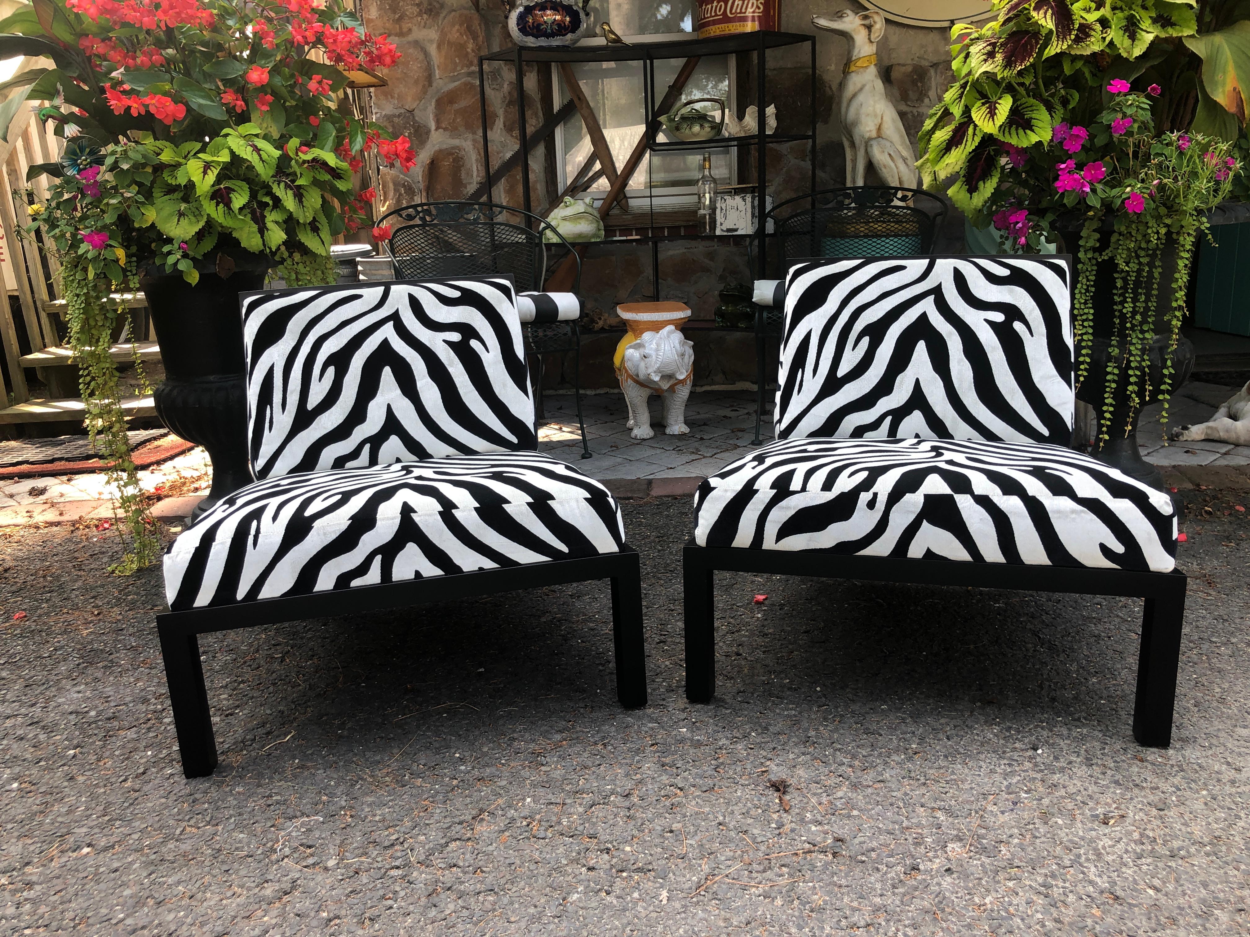 Stunning pair of Michael Taylor black lacquered slipper chairs by Baker. These fine chairs have been meticulously restored to like new condition-see photos. The frames have been re lacquered and the upholstery is brand new high end zebra velvet. The