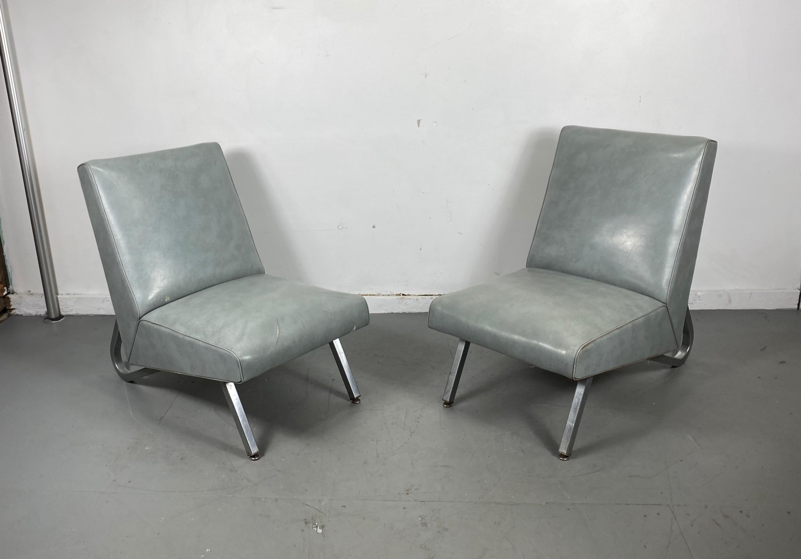 Nice matched pair of lounge chairs manufactured by Royal Metal manufacturing company, unusual square stock aluminum legs, Classic modernist design. Retains original sea foam blue naugahyde fabric, age appropriate wear., minor bumps and bruises.