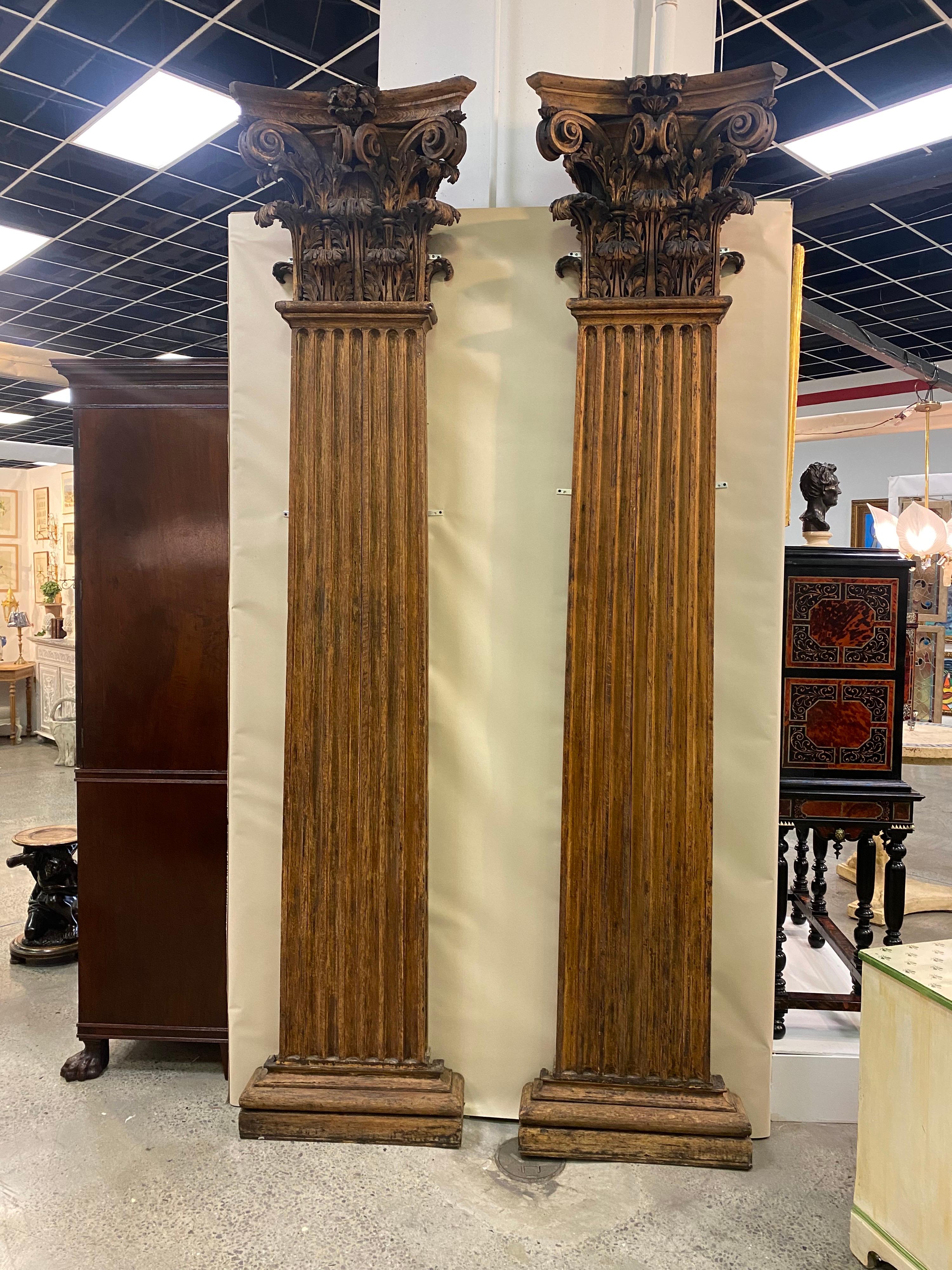 Absolutely stunning pair of 19th century hand carved neoclassical oak pilasters. 3 part pilasters to be wall mounted, with meticulously carved capitals with the perfect patina and color. Would really make a statement flanking a doorway or centered