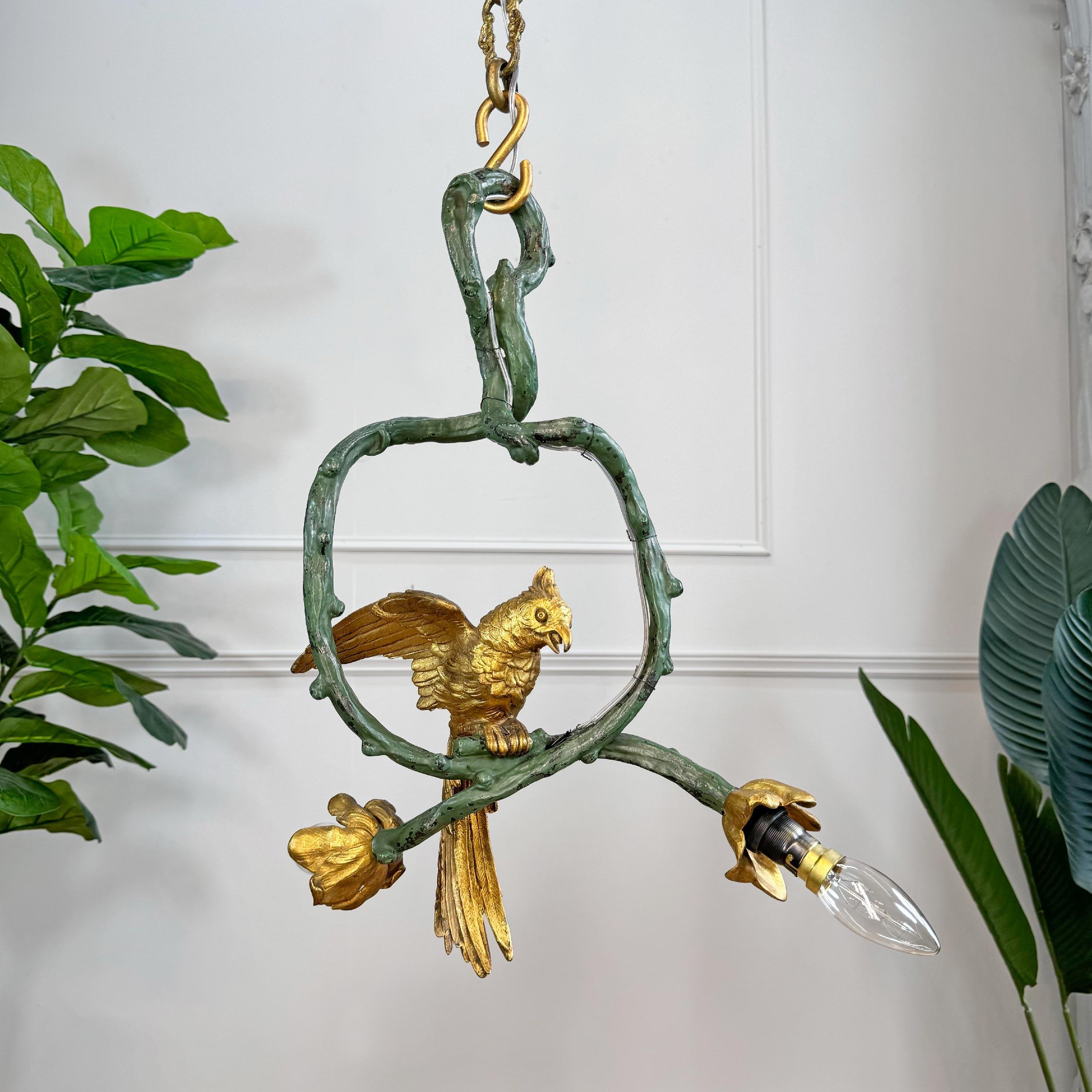 An astounding pair of circa 1890 French Art Nouveau painted bronze chandeliers, modeled as Cockatoos' perched within deep green oval branches, each hung from a length of period chain.



This rare pair of late 19th century lights each bears two lamp