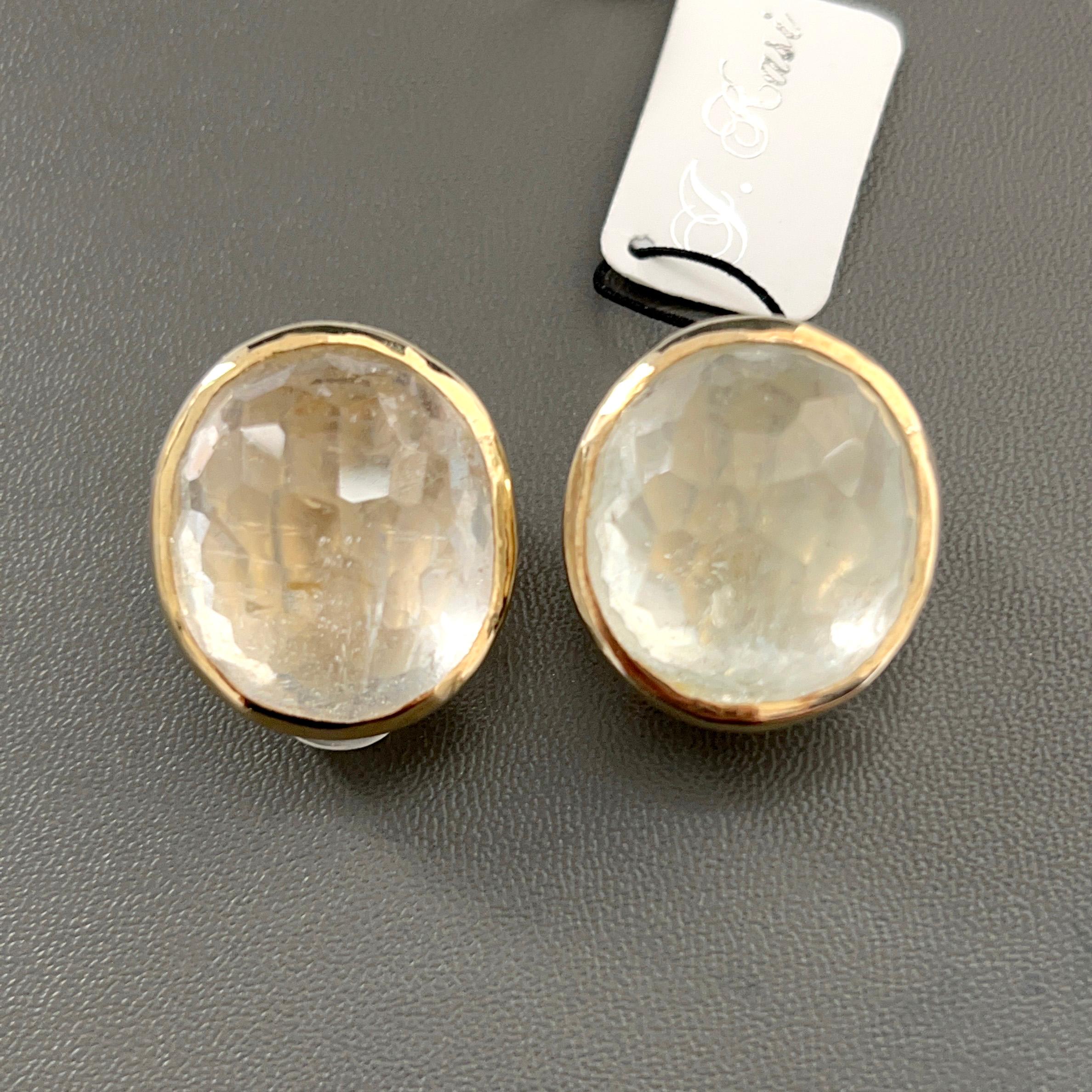 The stunning earrings feature a pair of large 85 carat multi-facet dome-shape genuine white topaz, hand bezel-set in 18k gold vermeil over sterling silver. Large and comfortable clip backing with rubber jacket for additional support allowing the