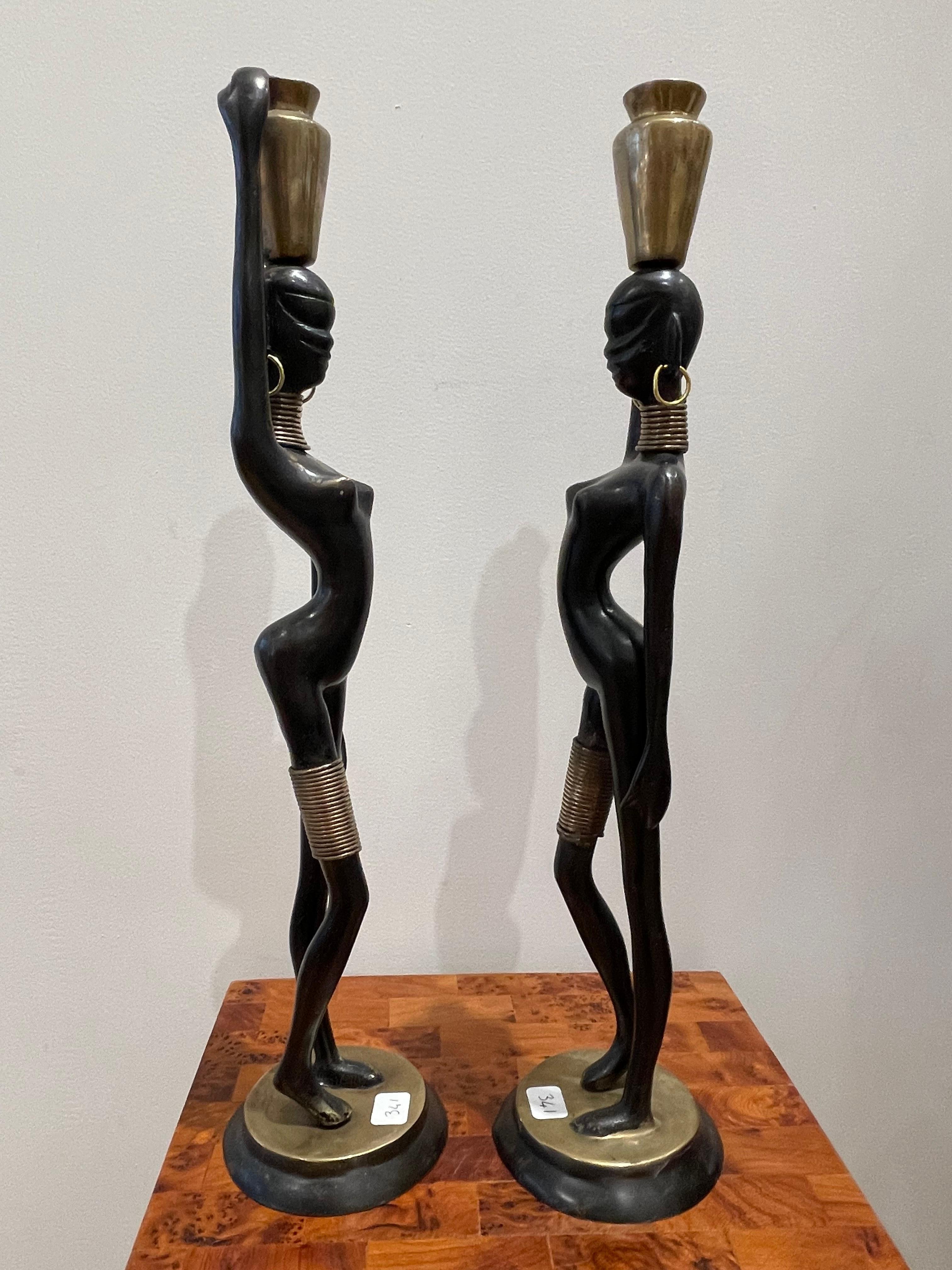 Patinated Stunning pair of African lady carrying water, in the style of  Hagenauer 1970 For Sale