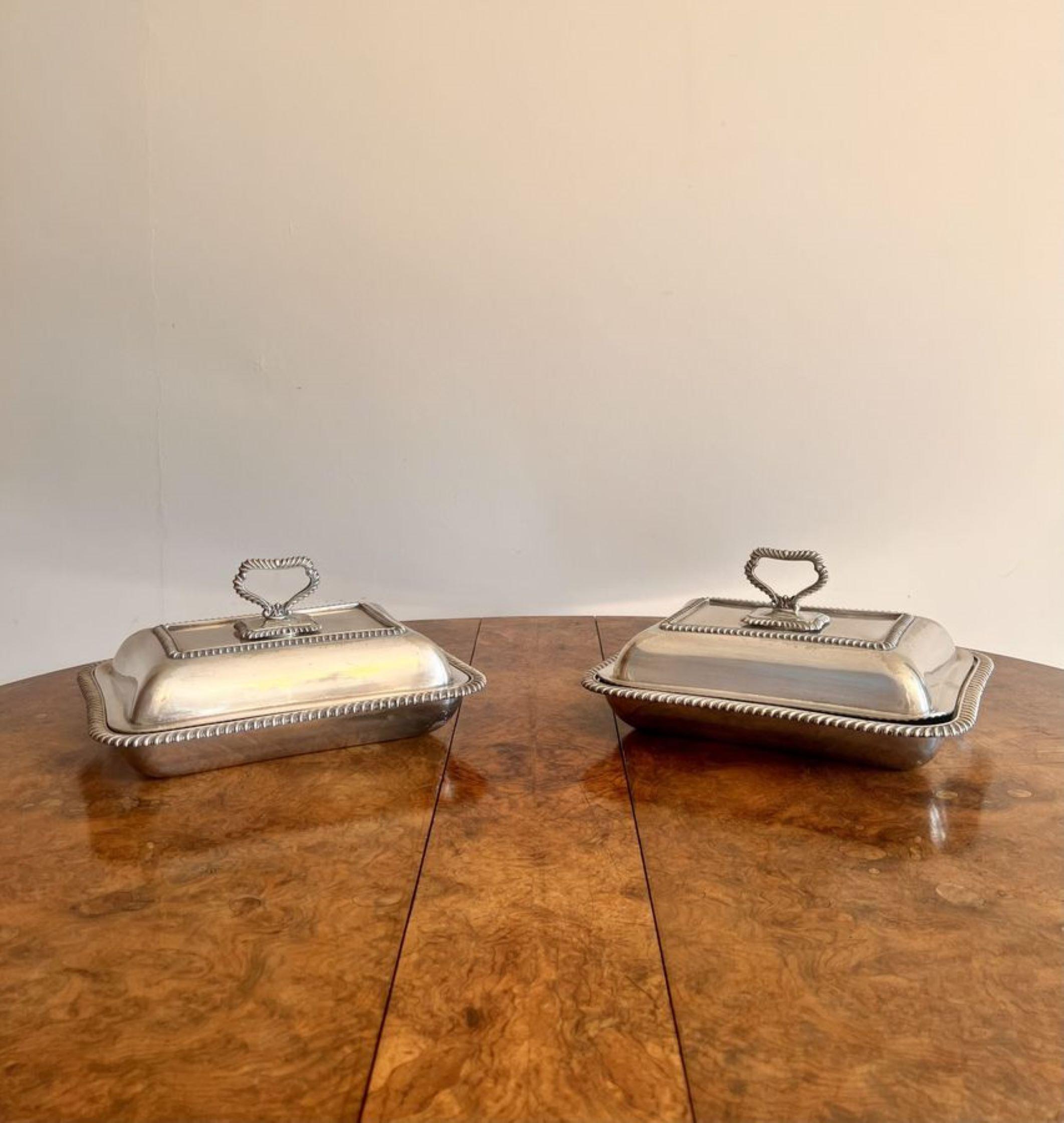 Stunning pair of antique Edwardian silver plated entree dishes having a quality pair of silver plated rectangular entree dishes with removable lids, ornate detail and ornate handles to the top.

D. 1900