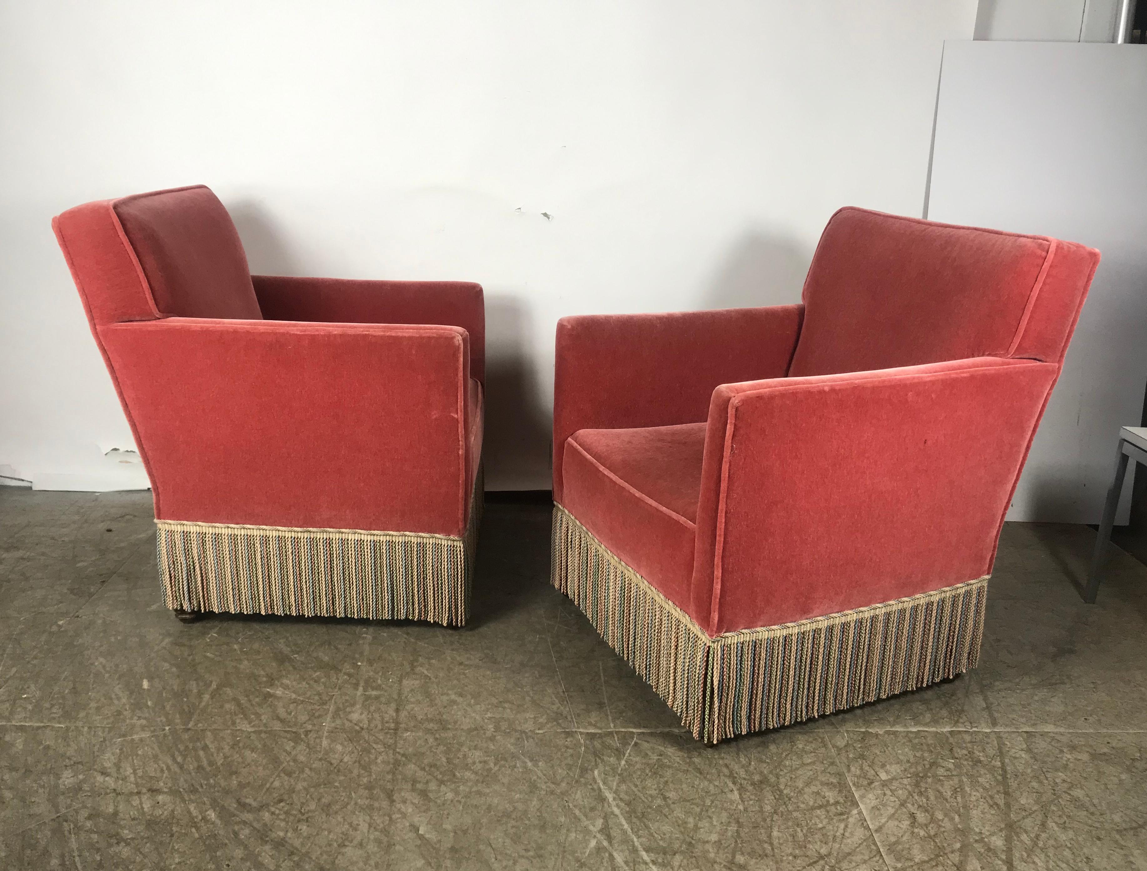 Stunning pair of Art Deco Salmon color Mohair club chairs, Classic modernist design, simple elegance, original salmon color mohair in wonderful condition, retains original fringe, extremely comfortable. Hand delivery avail to New York City or