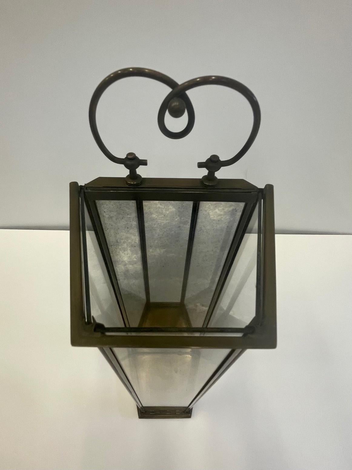 Lovely tall pair of brass and aged glass candle lanterns having mirrored interior.
Lots of character and style.