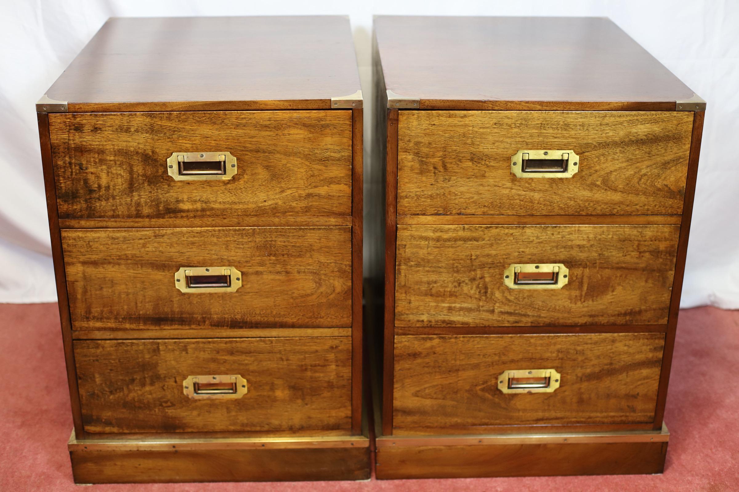 We delight to offer you this stunning pair of brass bound campaign style camphor-wood bedside chests or side cabinets of three short drawers on plinth bases , in lovely condition .
Don't hesitate to contact me if you have any questions.
Please have
