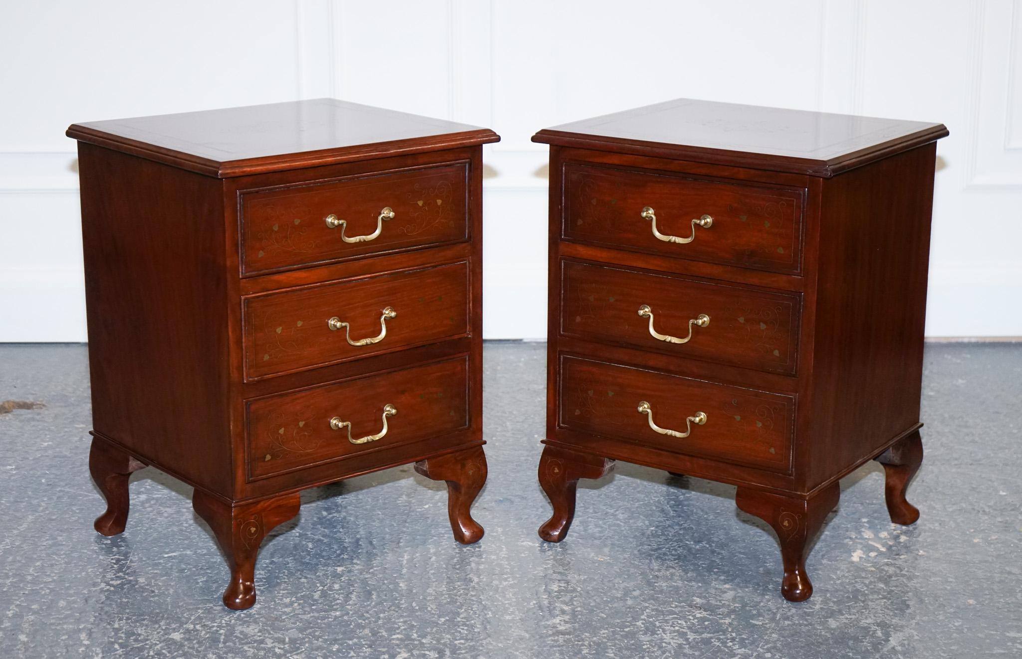We are delighted to offer for sale this Stunning Pair of Brass Inlaid Anglo Indian Nightstands.

These Anglo-Indian bedside tables are a truly stunning addition to any bedroom. Handcrafted from solid brass, the tables feature intricate geometric