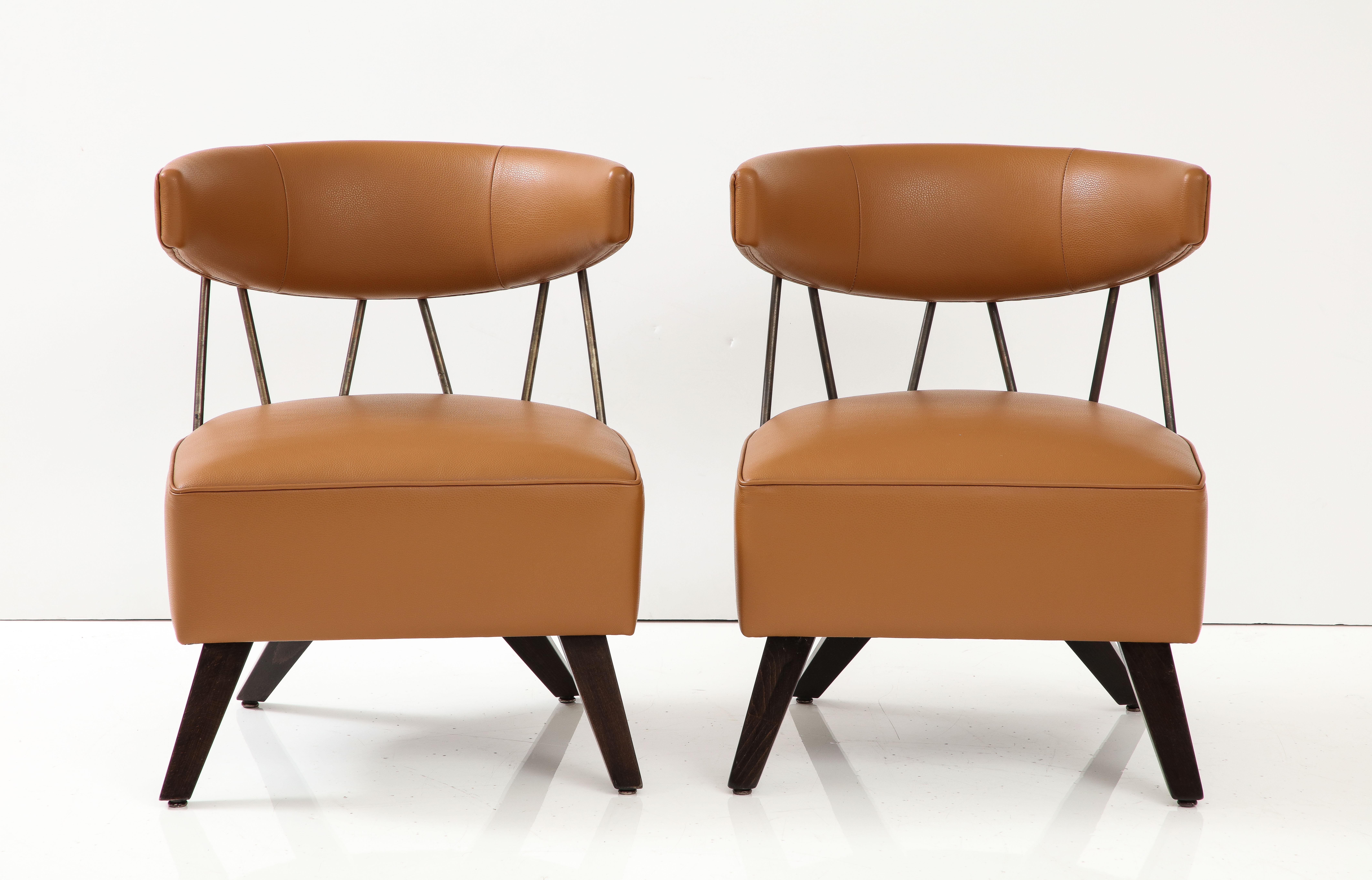Stunning pair of Klismos inspired chairs attributed to Billy Haines.
The chairs have been Beautifully reupholstered in a Tobacco colored leather,
and are featured in the book 