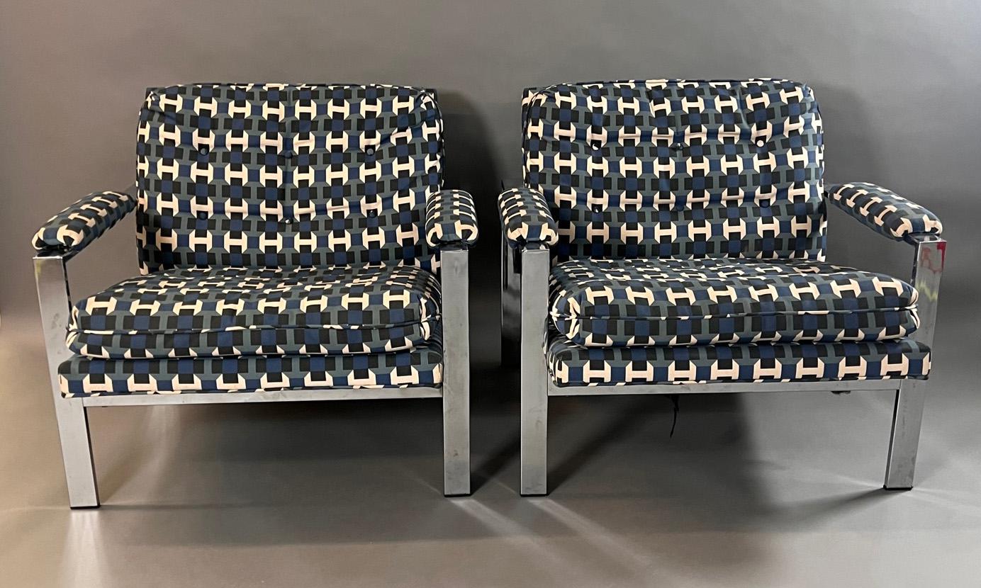 Very heavy high end pair of flat bar chrome lounge chairs, upholstered in Hermes fabric.