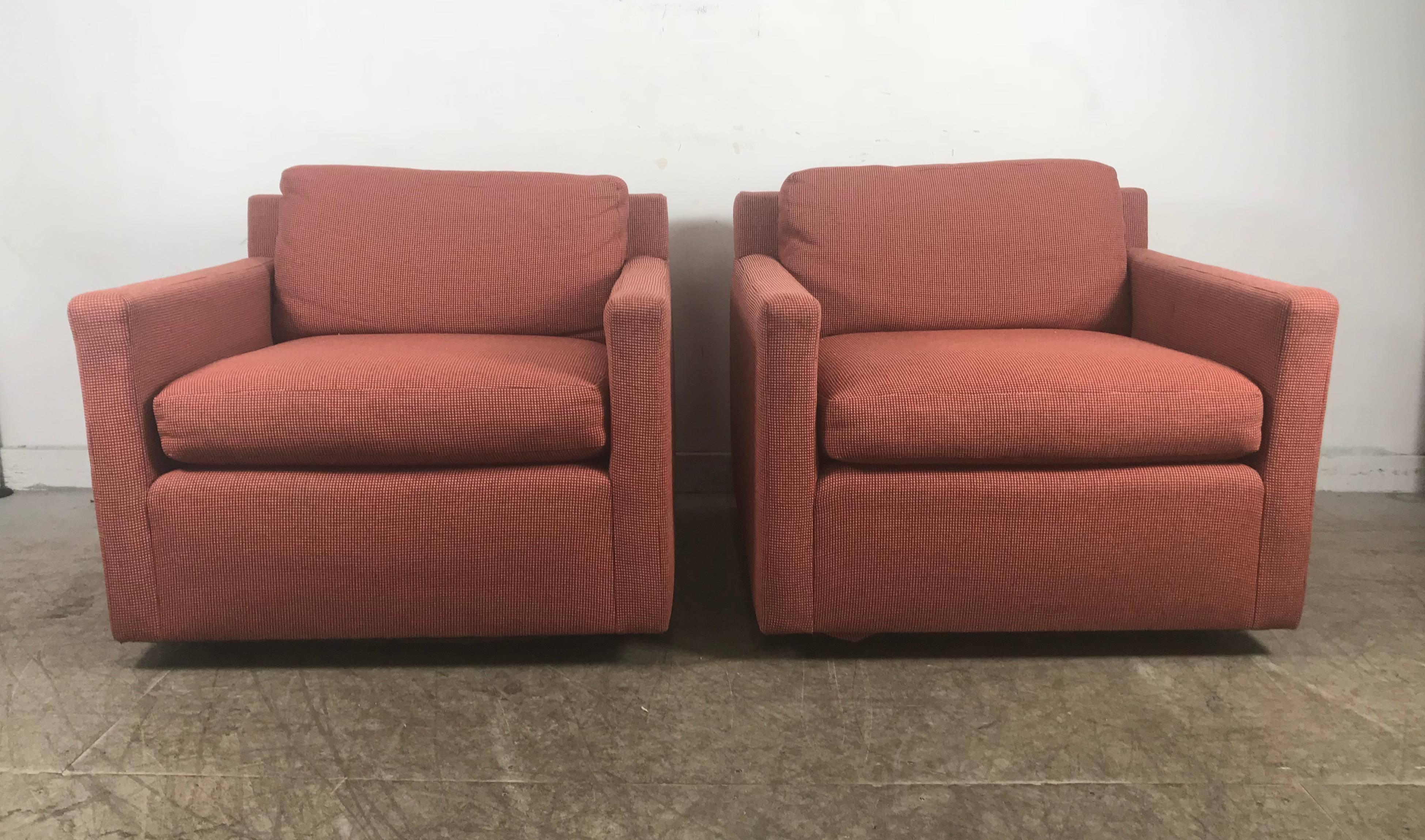 Stunning pair of cube lounge chairs attributed to Milo Baughman. Classic floating design. Black lacquer plinth base. Retains original orange or salmon wool fabric upholstery.