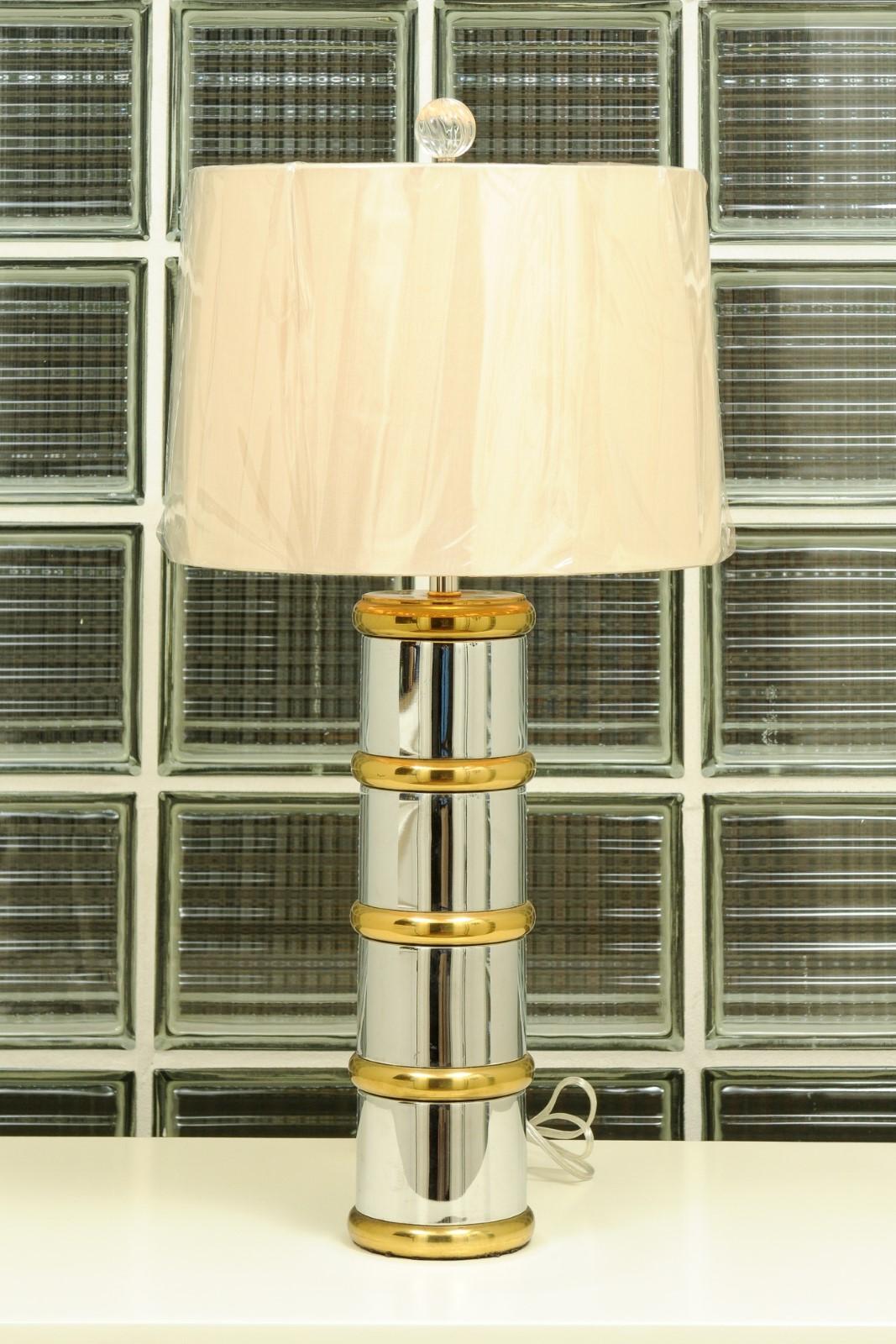 These magnificent lamps are shipped as photographed and described, complete with new shades, harps and finials. Completely Installation Ready.

A stellar pair of stylish faux-bamboo lamps in chrome and brass, circa 1970. Beautiful detail, weight