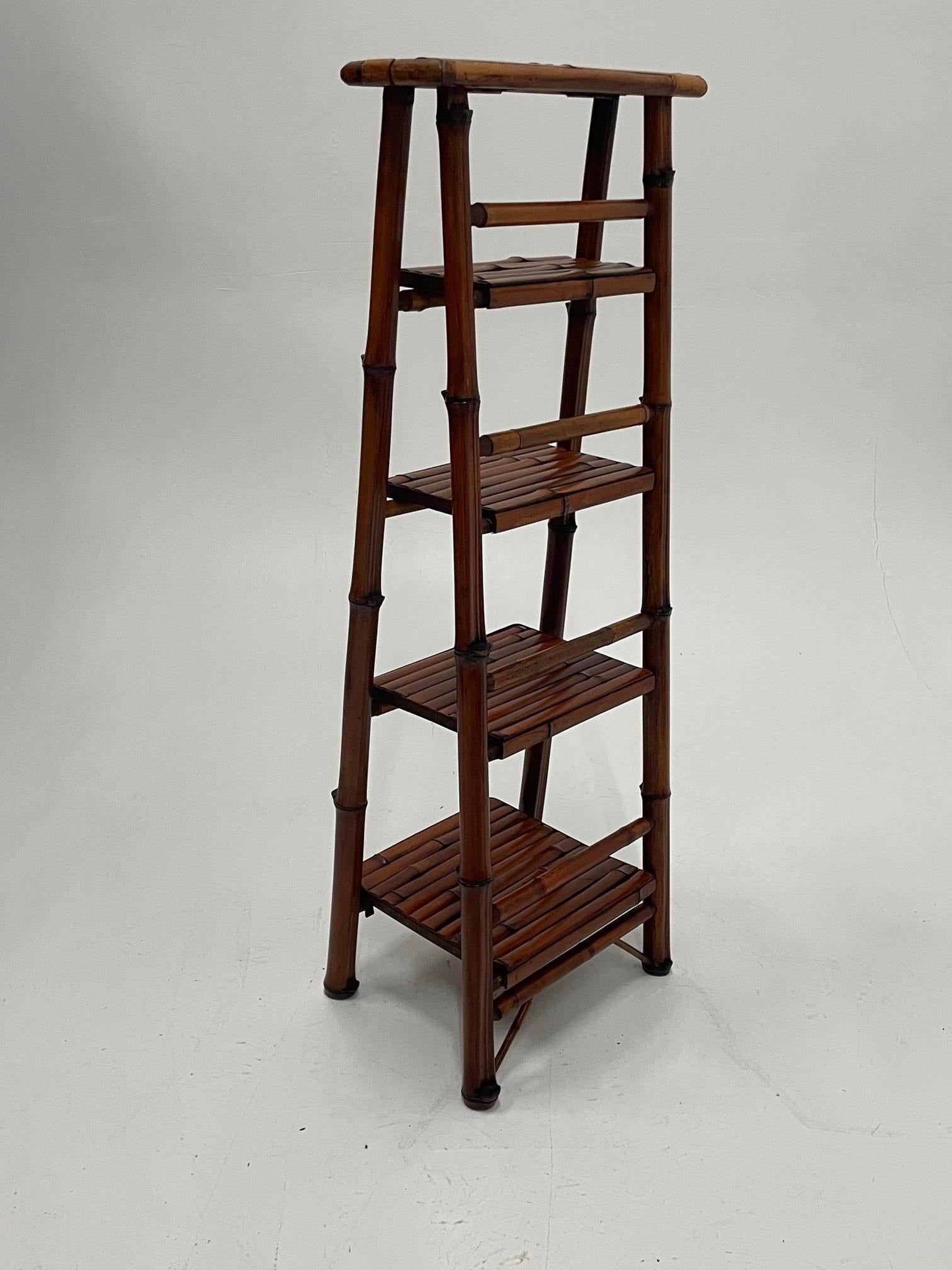 Unusual pair of versatile ladder style bamboo etageres or book shelves having 4 graduated shelves.
Depth of shelves from top to bottom, 6