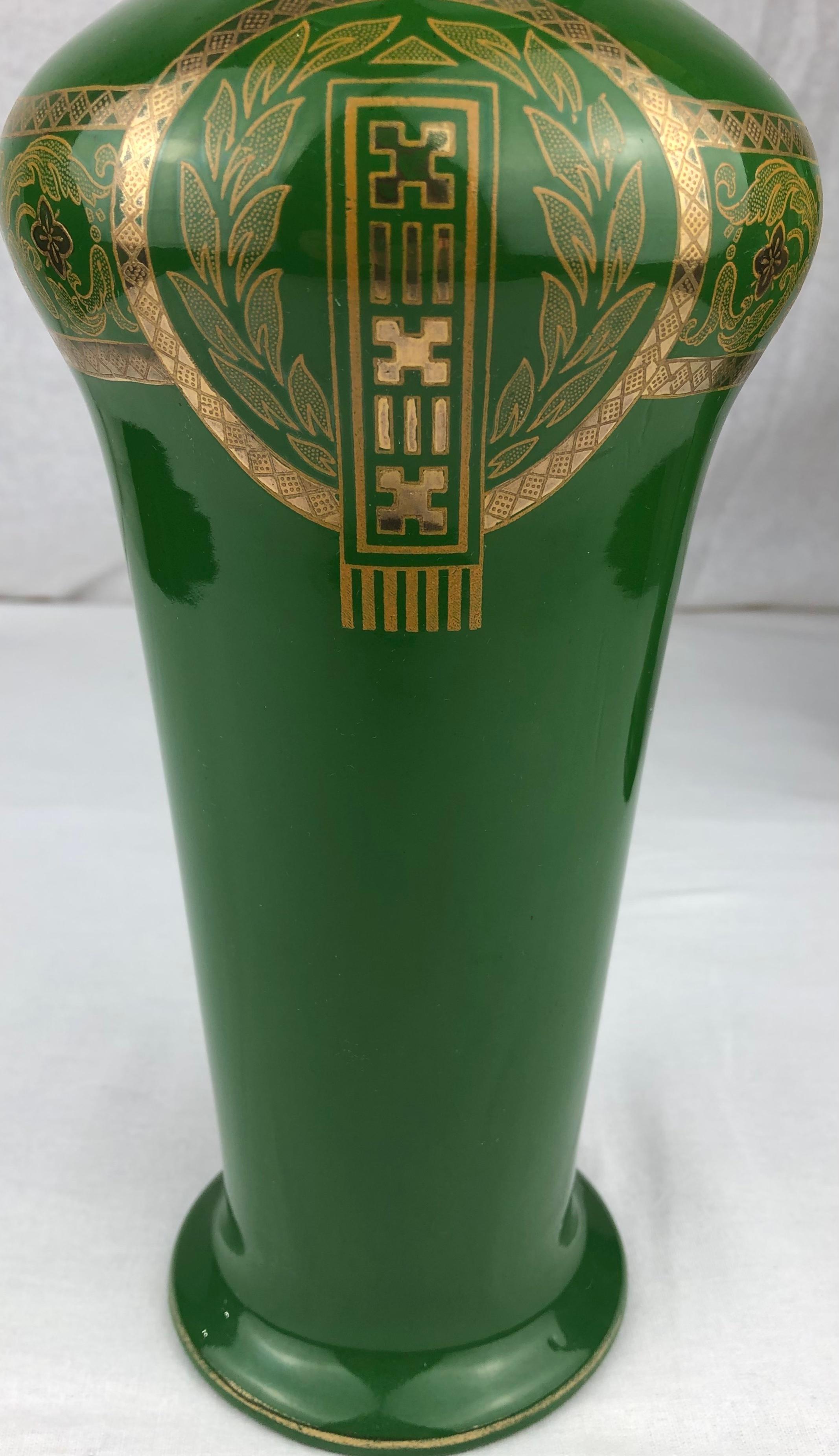 Intricately detailed pair of French Art Deco porcelain vases manufactured by Sarreguemines. These fine quality vases are made from very good quality porcelain and are in very good antique condition. 
Stunning green and gold colors under a glazed