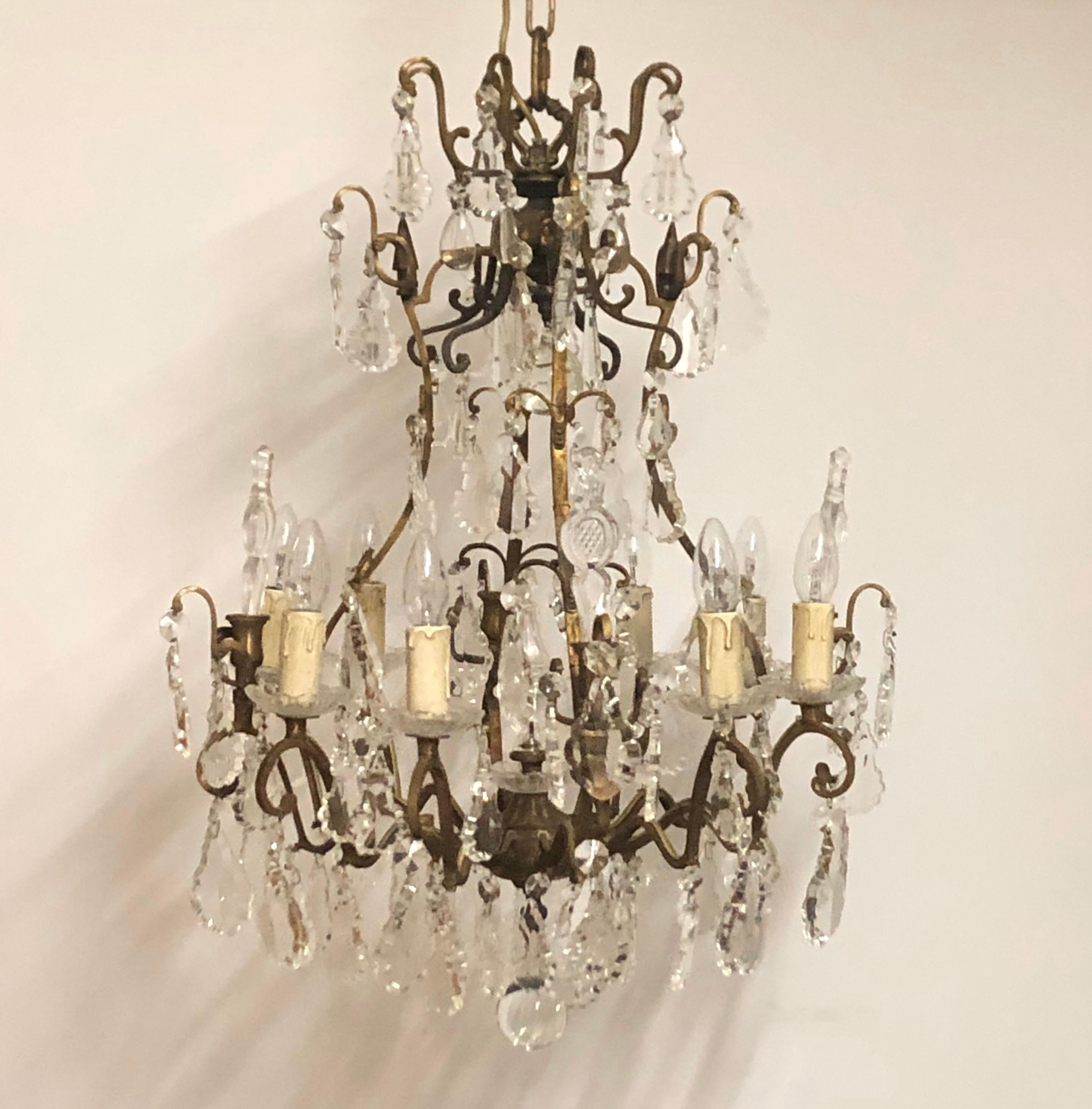 Beautiful eight -light massiv bronze and crystal glass chandelier, France, circa 1970s.
Pair available.
The height incl. chain is 55.11