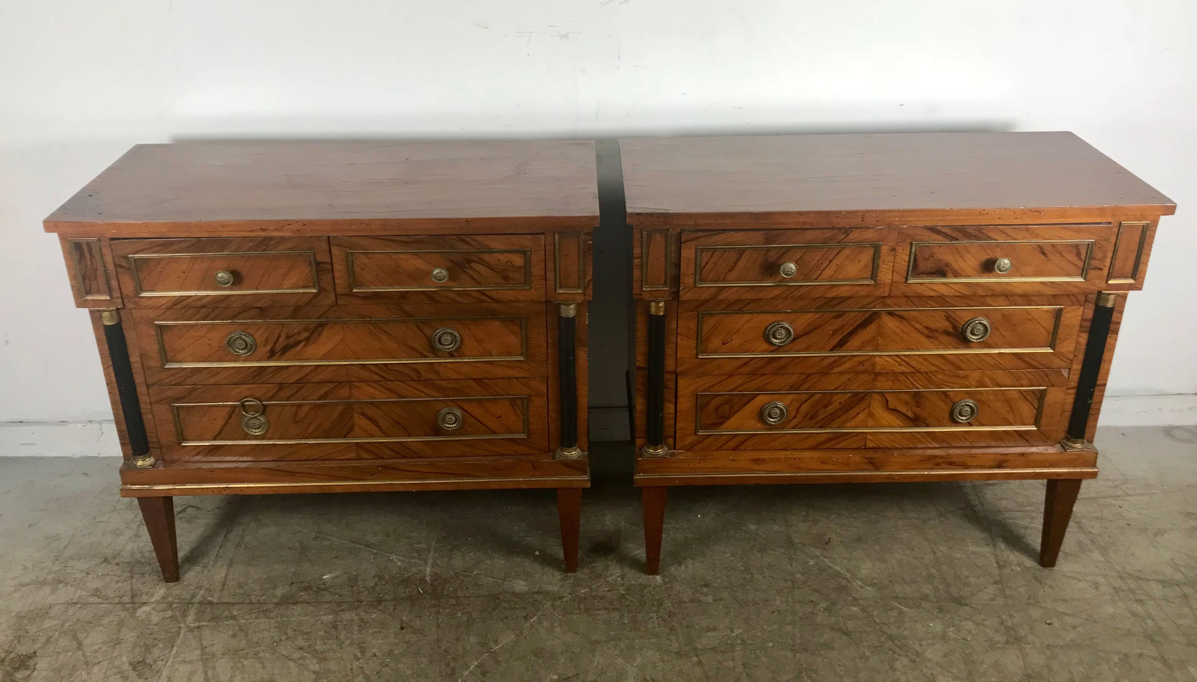 Stunning pair of French Directoire style commodes in rosewood, classic styling, brass hand pulls as well as brass inlay details, Hand delivery avail to New York City or anywhere en route from Buffalo NY.