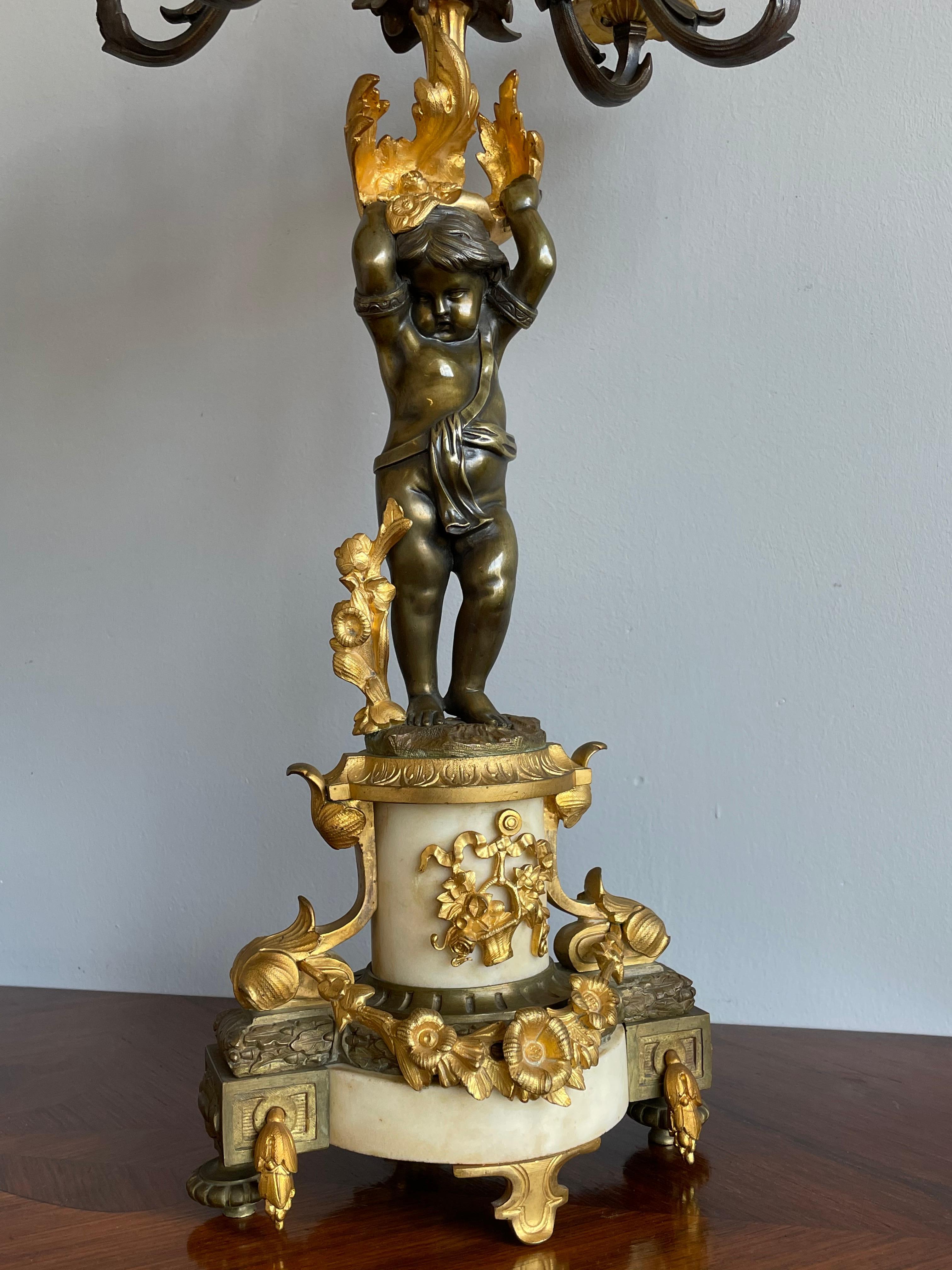 Top quality made and large pair of antique 6 candle candelabras with putto sculptures.

In mid 19th century Europe, the most beautiful candelabras and chandeliers were created and manufactured by the famous designers and makers in France. This