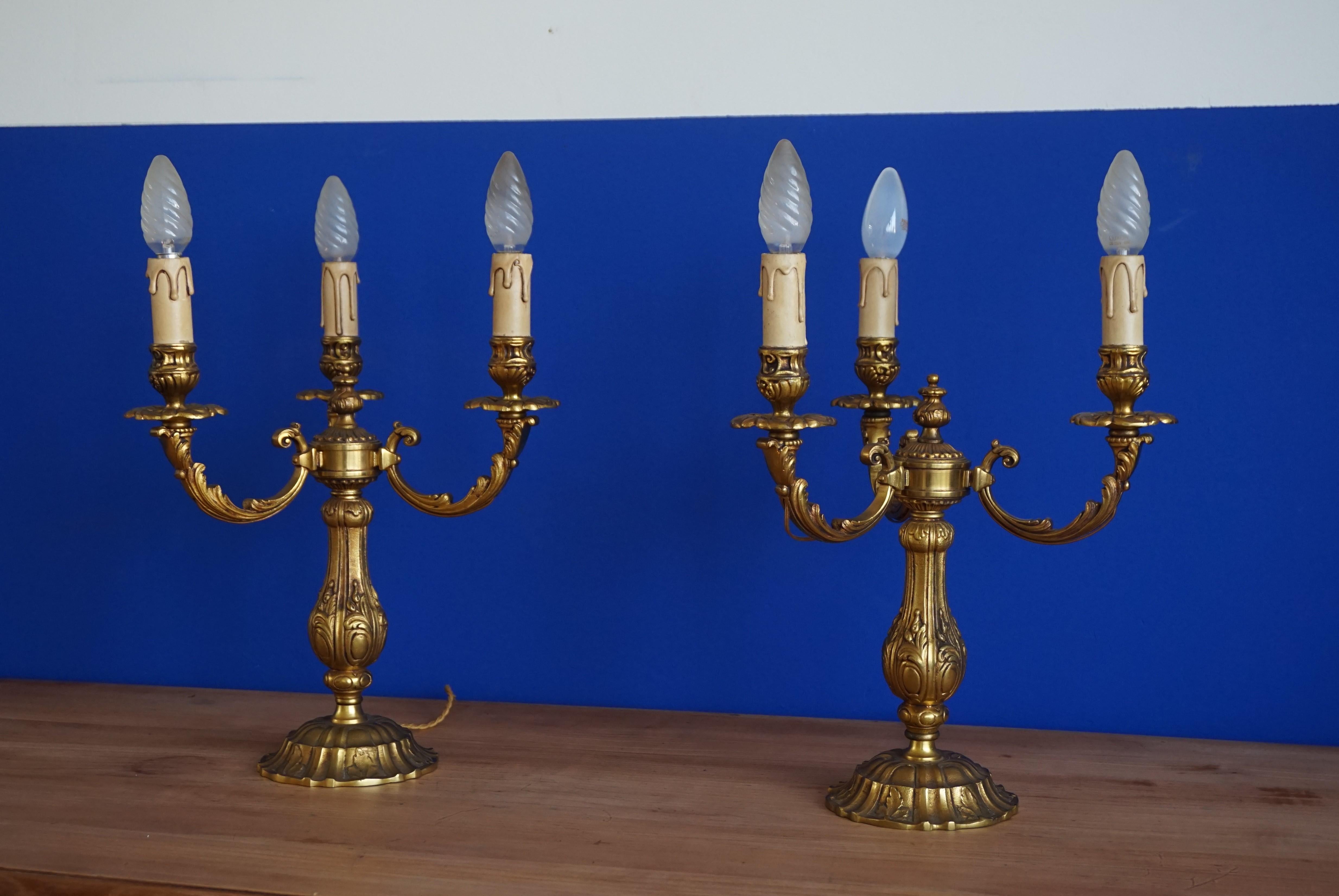 Rare, stylish and highly decorative French table pieces.

This glorious and elegant pair of solid bronze candelabras will look great in the middle of your dining table, but also on a large side table or credenza. Thanks to their wide bases and good