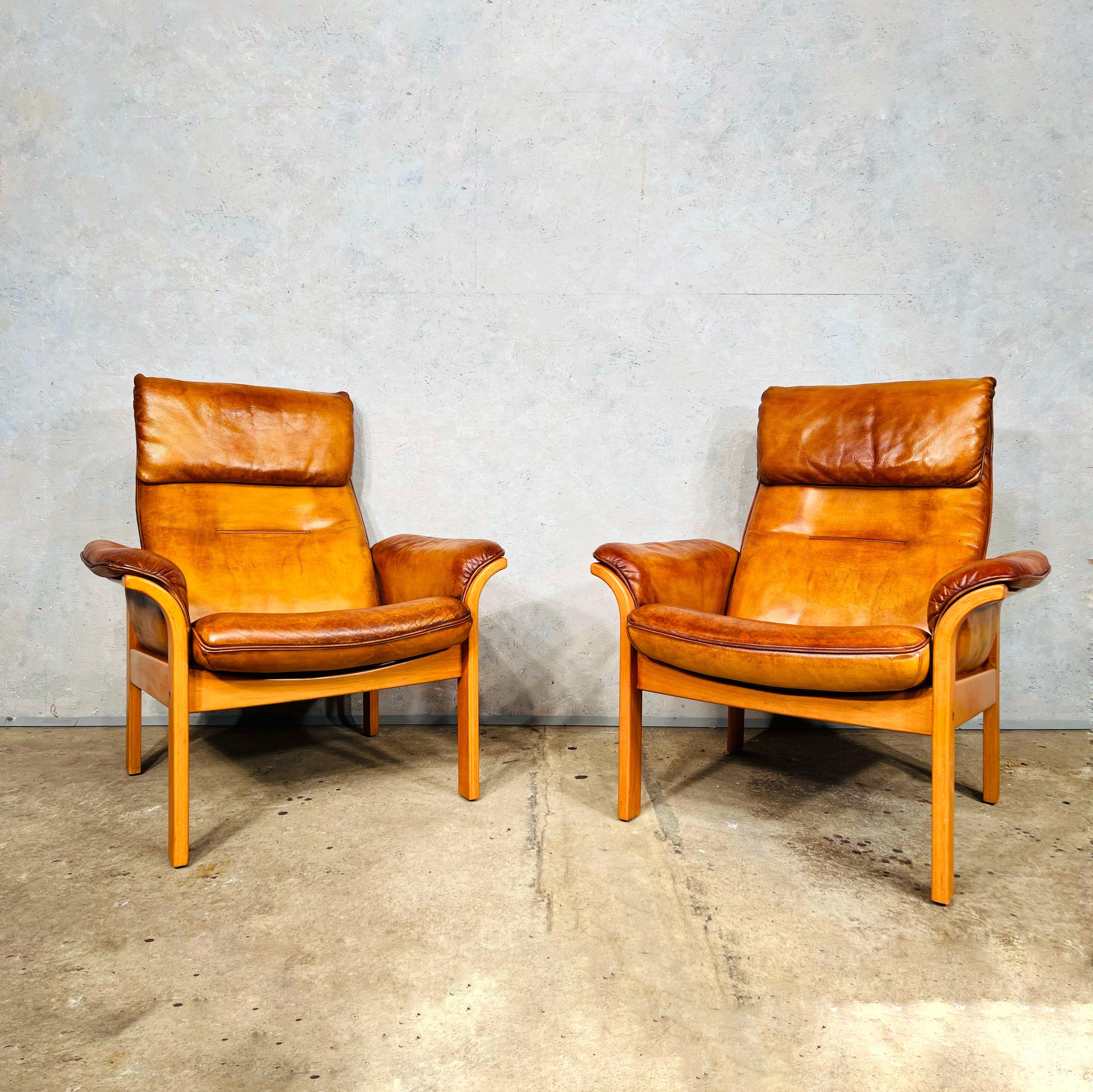 A stunning pair of Gote Mobler Reclining Leather Armchairs Tan with a solid beech frame, great design, very comfortable to sit in, compact and neat proportions, hand dyed a most beautiful tan colour with a great finish.

In great