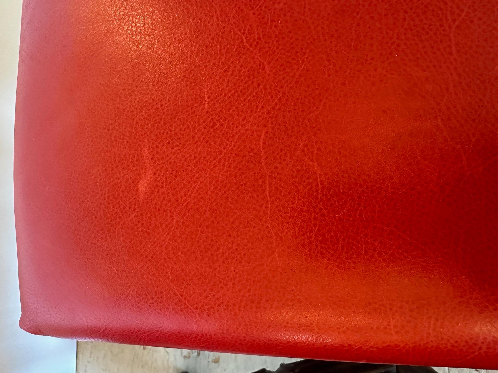 Pair of handsome red leather and dark wood Hancock & Moore custom benches finished with brass nailheads.

