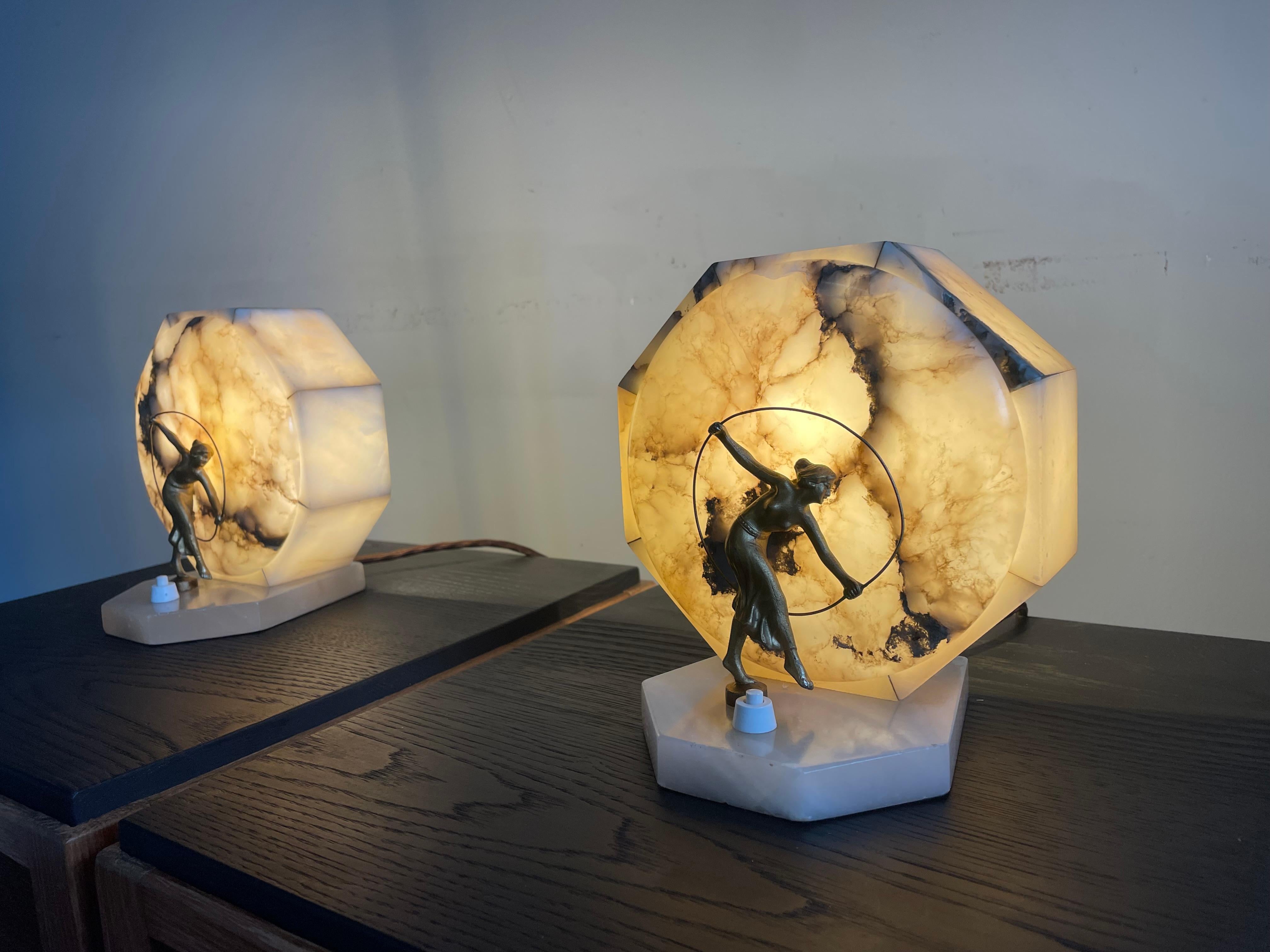 Pure Art Deco alabaster table lamps with female dancer sculptures.

This very rare pair of French Art Deco table lamps is another one of our recent great finds. Whether you place them relatively close to each other on a side table or even further