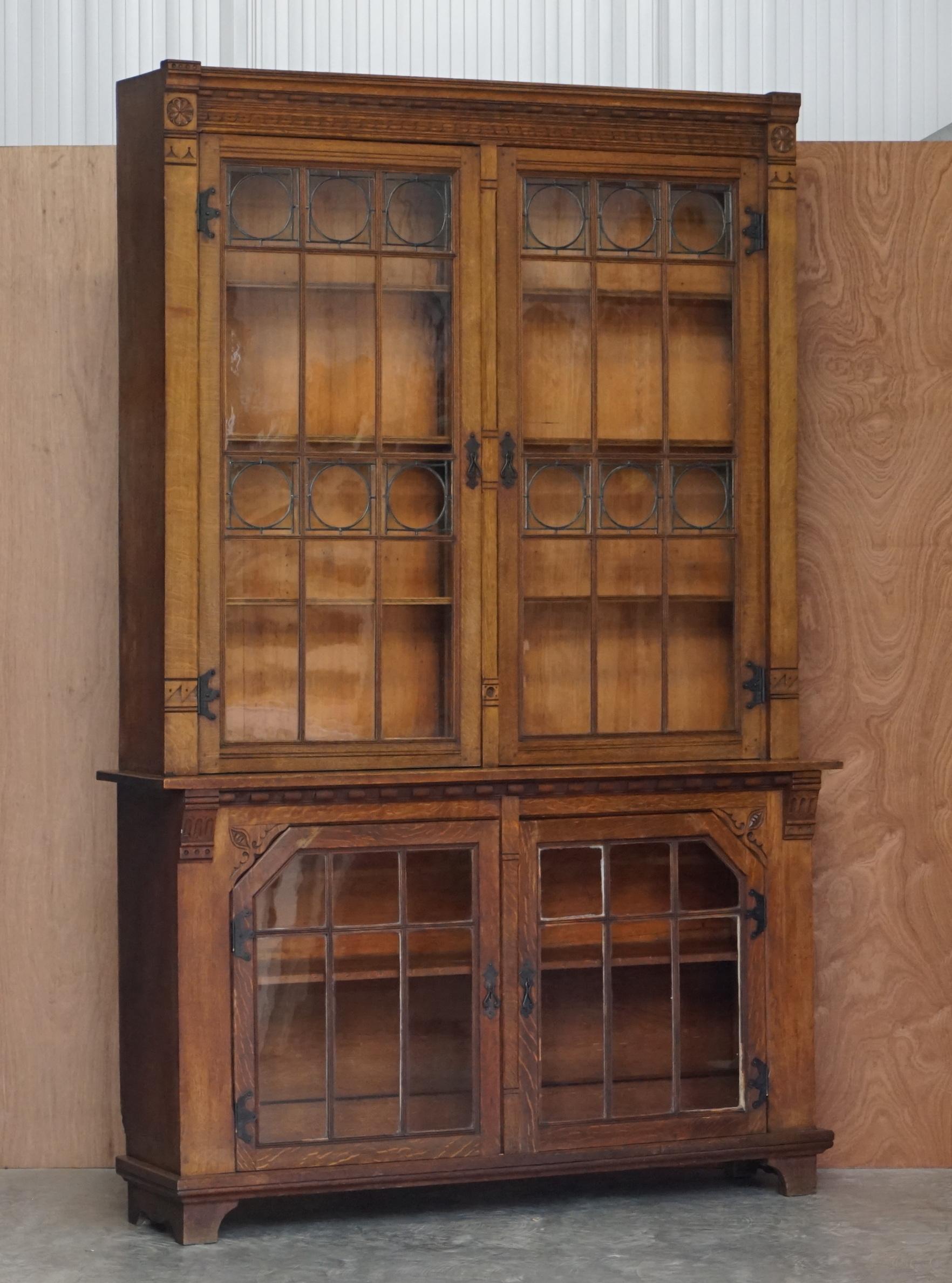 We are delighted to offer this exquisite pair of really quite huge English oak library bookcases with wrought iron fixtures and fittings and lead lined glass doors 

A beautifully made pair, these can hold an entire at home library and more, they