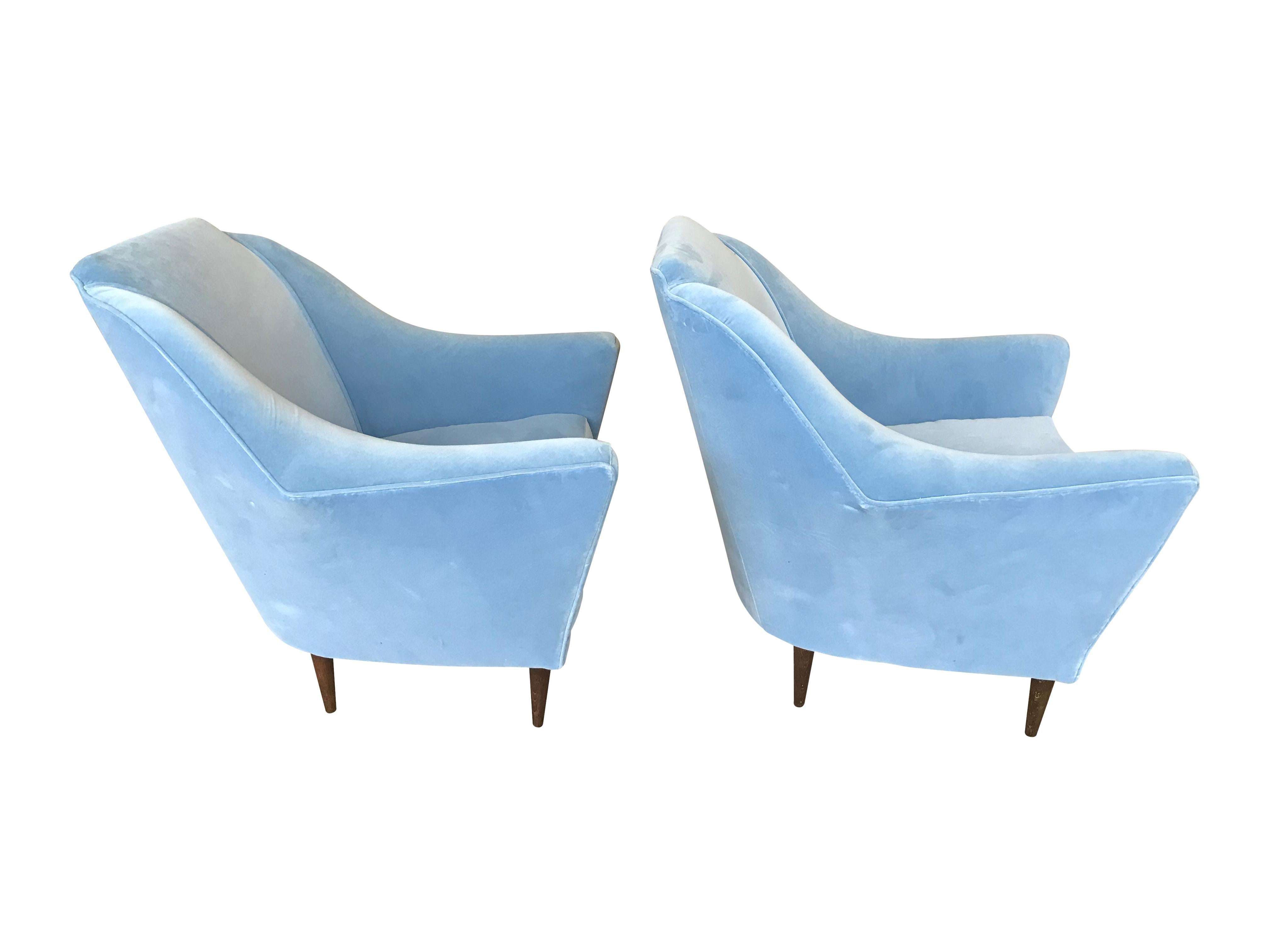 A stunning pair of Ico Parisi armchairs re upholstered in Designers Guild baby blue velvet, with rosewood legs.

Also available is a matching Ico Parisi curved sofa - See other listing under Ed Butcher London storefront. 