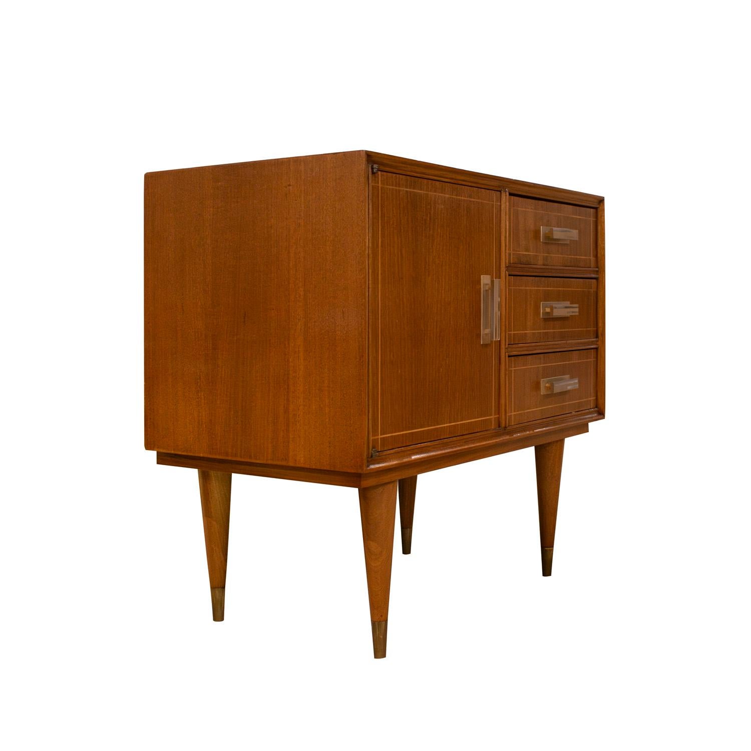 Pair of beautifully crafted bedside tables in mahogany with satinwood inlays, each with 3 drawers and a door, with clean-line brass pulls and brass sabots, Italian 1950's. These bedside tables are very elegant and hand-crafted.  The pulls are