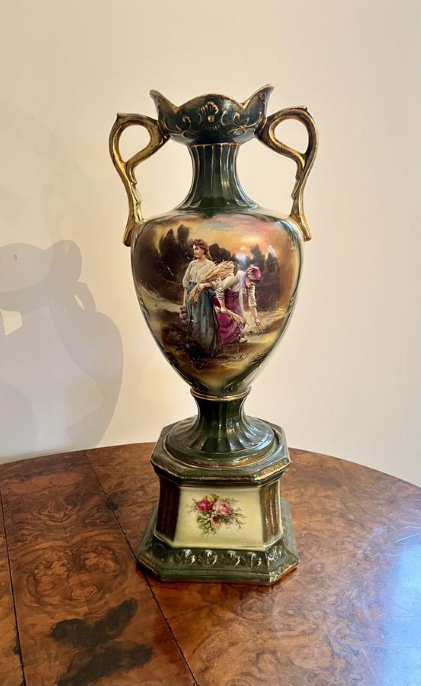 Stunning pair of large antique Victorian vases having a quality pair of antique Victorian vases, with a green ground decorated with beautiful flowers on one side and a figural scene to the other side, hand painted in stunning pink, yellow, green,