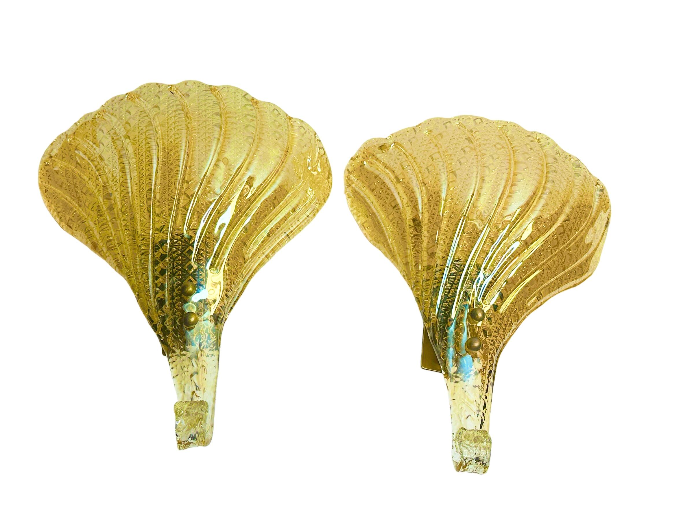 Incredible pair of mid century Murano glass leaf wall sconce with heavy brass fixture. This wonderful piece was designed in Italy by Barovier & Toso during the 1960s.
Each sconce is outstanding as the way the leaf is designed in detail on the edges