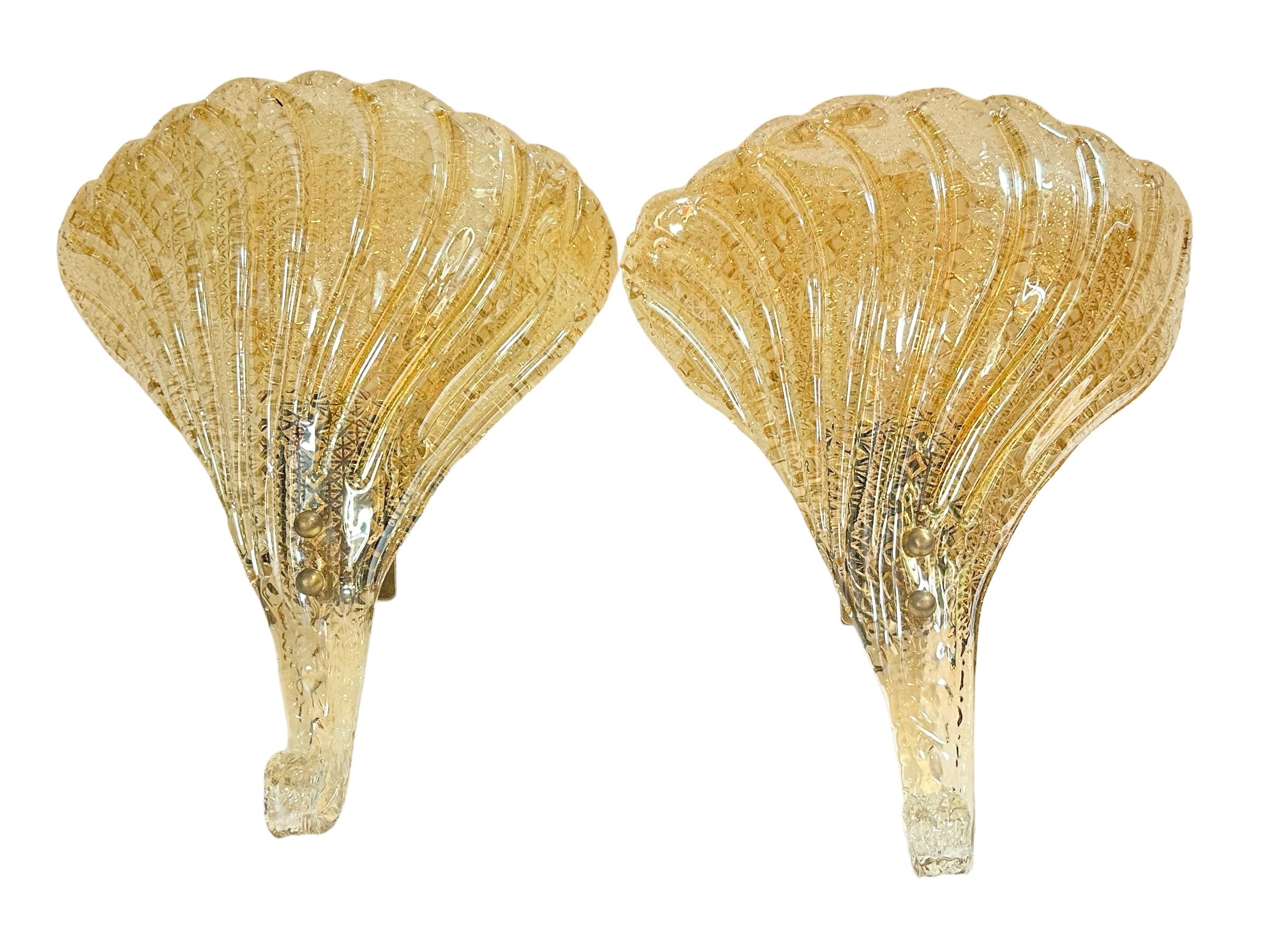 Incredible pair of mid century Murano glass leaf wall sconce with heavy brass fixture. This wonderful piece was designed in Italy by Barovier & Toso during the 1960s.
Each sconce is outstanding as the way the leaf is designed in detail on the edges