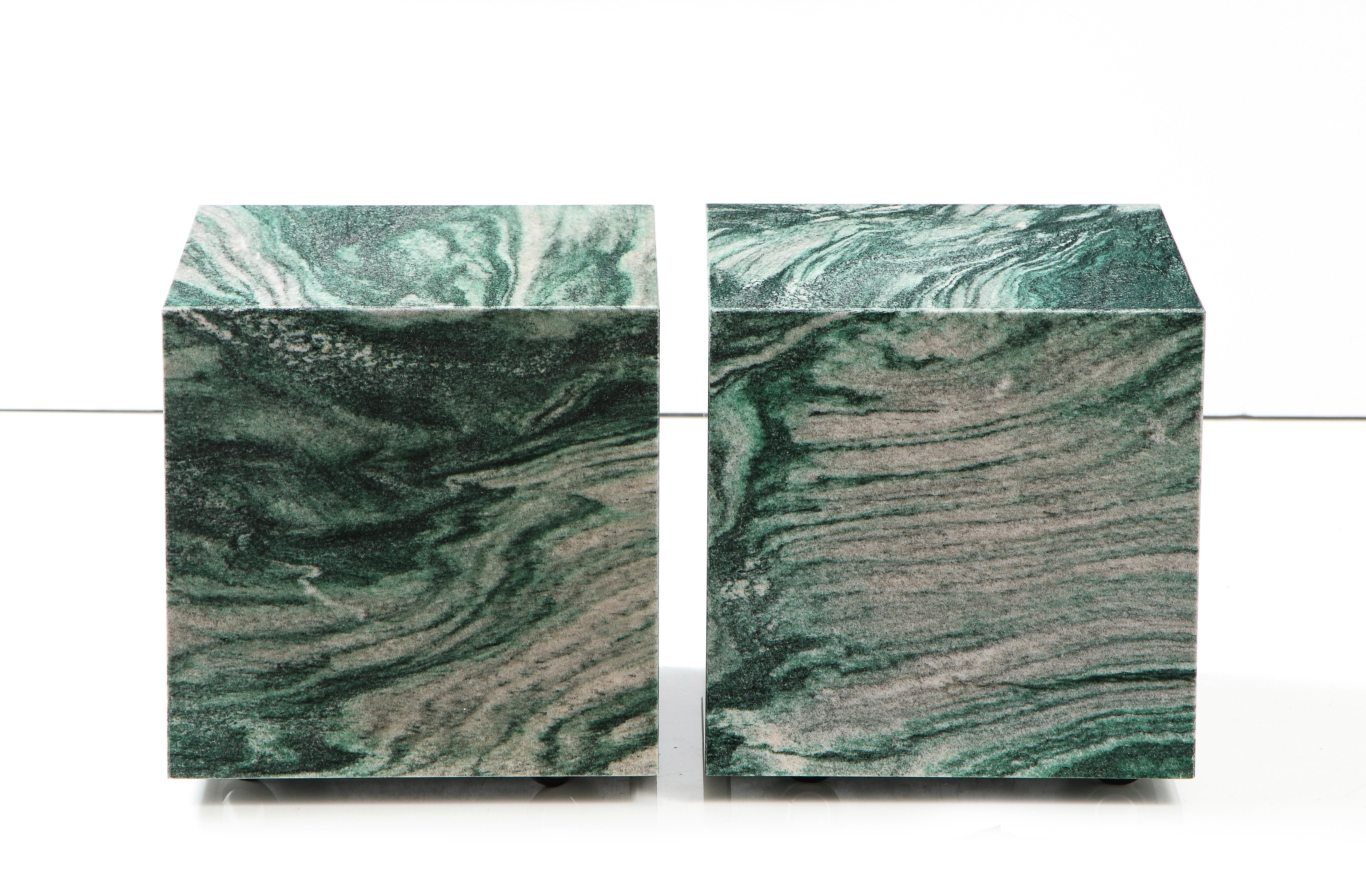 Stunning pair of Polar Verde marble cube tables.
The matched marble makes for a beautiful pair of end tables that are easily
moveable as they are on polished chrome casters.
They can also be used together as a coffee table.