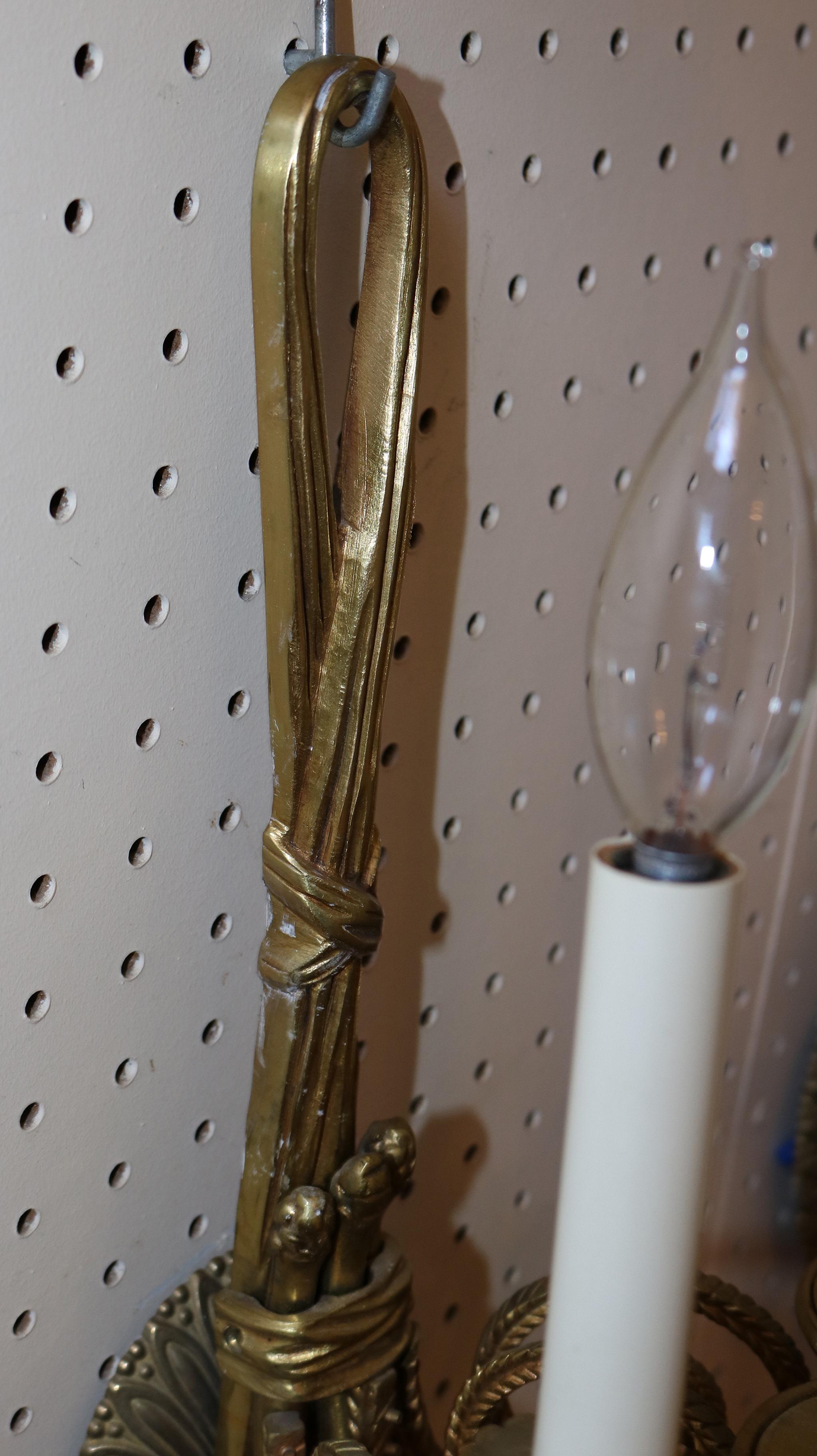 Stunning Pair of Solid Brass 3 Arm Louis XVI French Style Ribbon Sconces In Good Condition In Long Branch, NJ