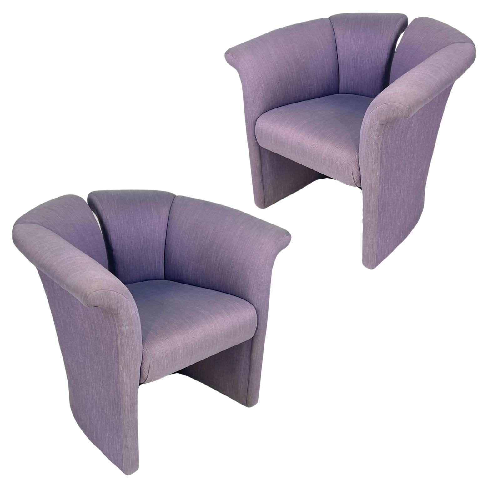This unique pair of highly styled postmodern accent chairs are covered in a richly toned durable upholstery. The chairs feature great lines with a striking fanned back and curved arms for superior comfort. Fun, comfortable chairs for midcentury or