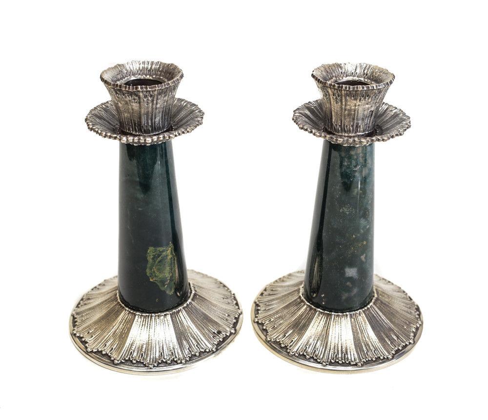 A stunning pair of Buccellati Rouche green stone candlesticks. Linenfold texture to the silver and green stone to the stem. Marked Buccellati 925 to the underside base. 

Weight approximately, 38 ozt.