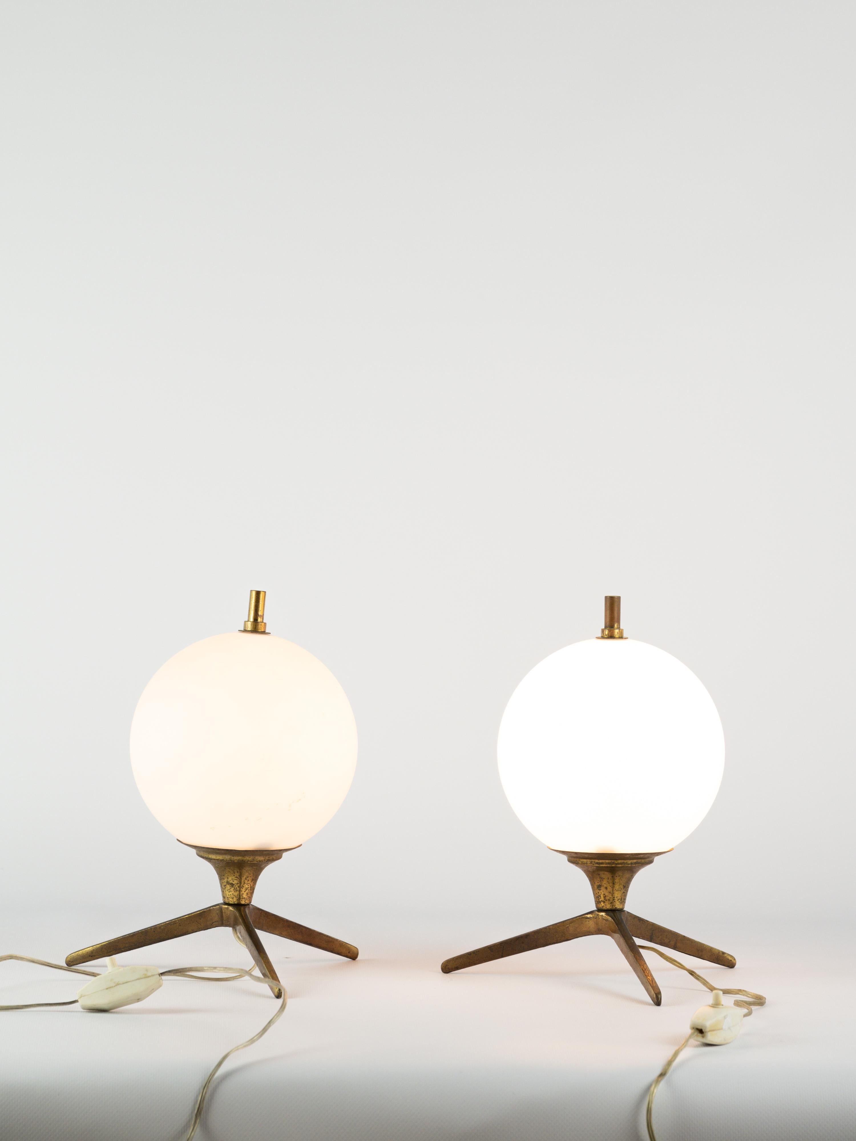 Stunning pair of table lamps in brass and opaline. 

3 feet structure. 

Italian work circa 1950

Italian plug

More information upon request 