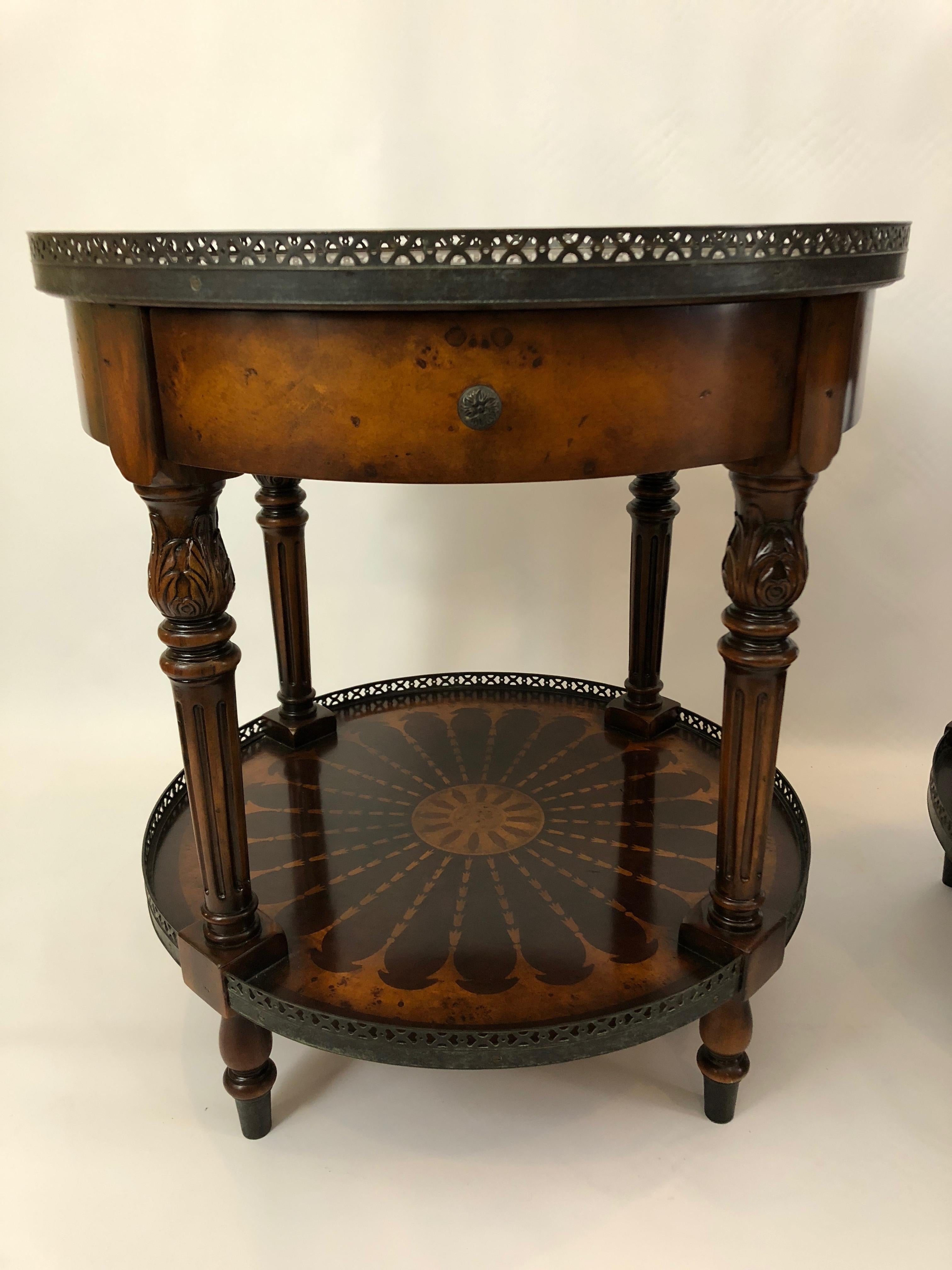 Impressively crafted pair of two-tier zebrawood and burl round side tables having handsome brass galleries, turned legs, single drawer, and unbelievably intricate inlaid patterned design that looks like art itself.