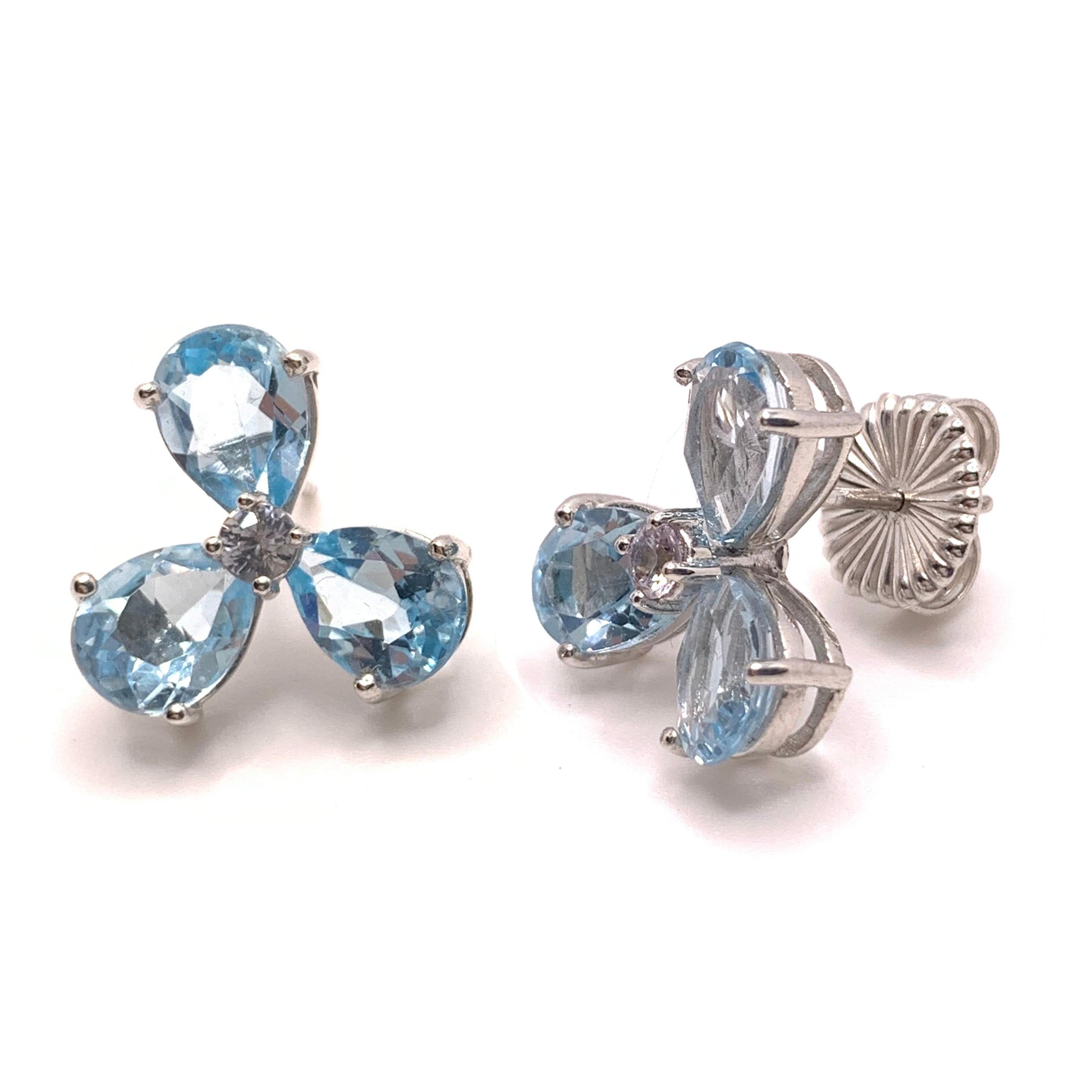 These stunning pair of earrings feature genuine pear-shape blue topaz and round white sapphire handset in platinum rhodium plated sterling silver, straight post with large friction earring back. The post is set slightly above the center of the