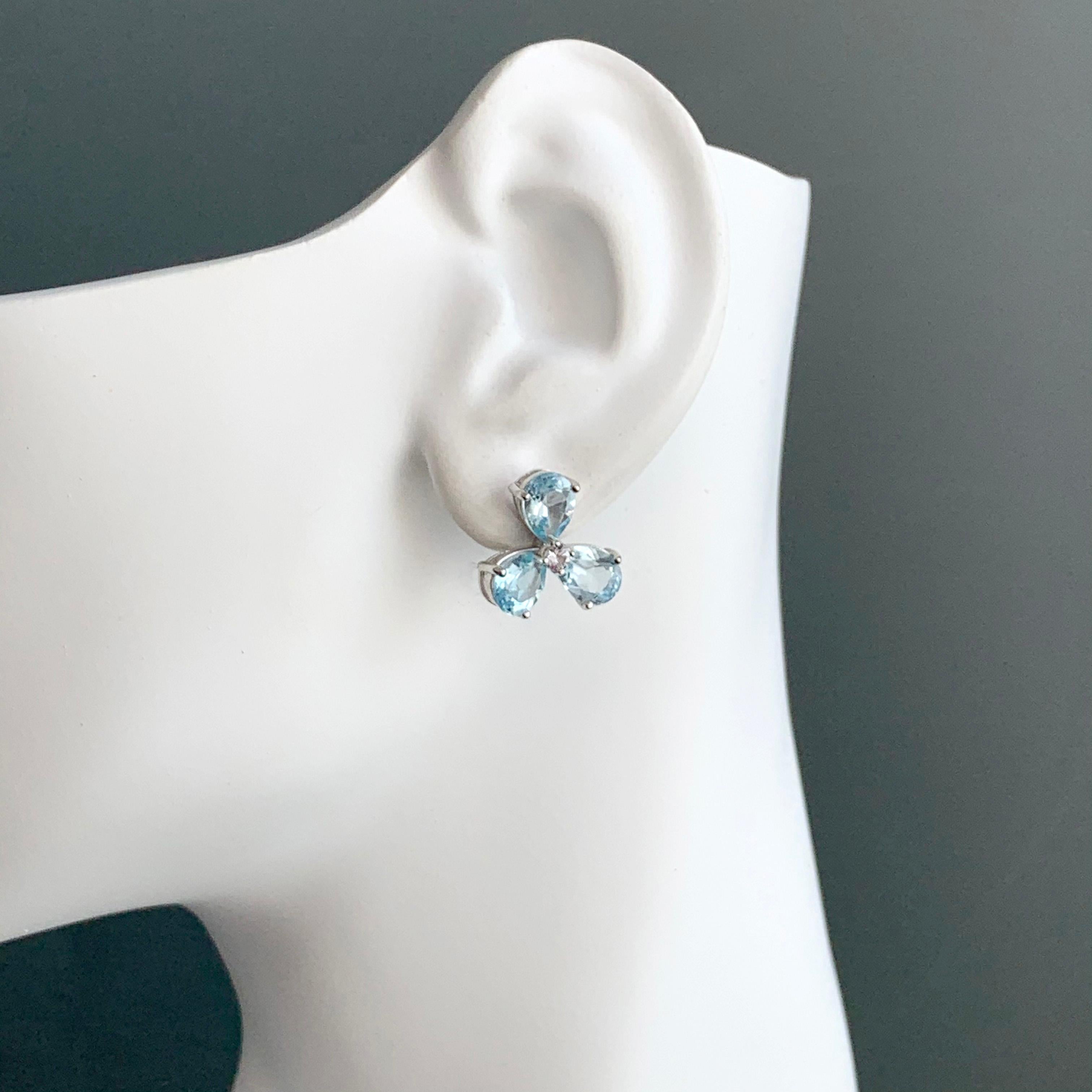 Stunning pair of Three-petal Genuine Blue Topaz Flower Earrings In New Condition In Los Angeles, CA