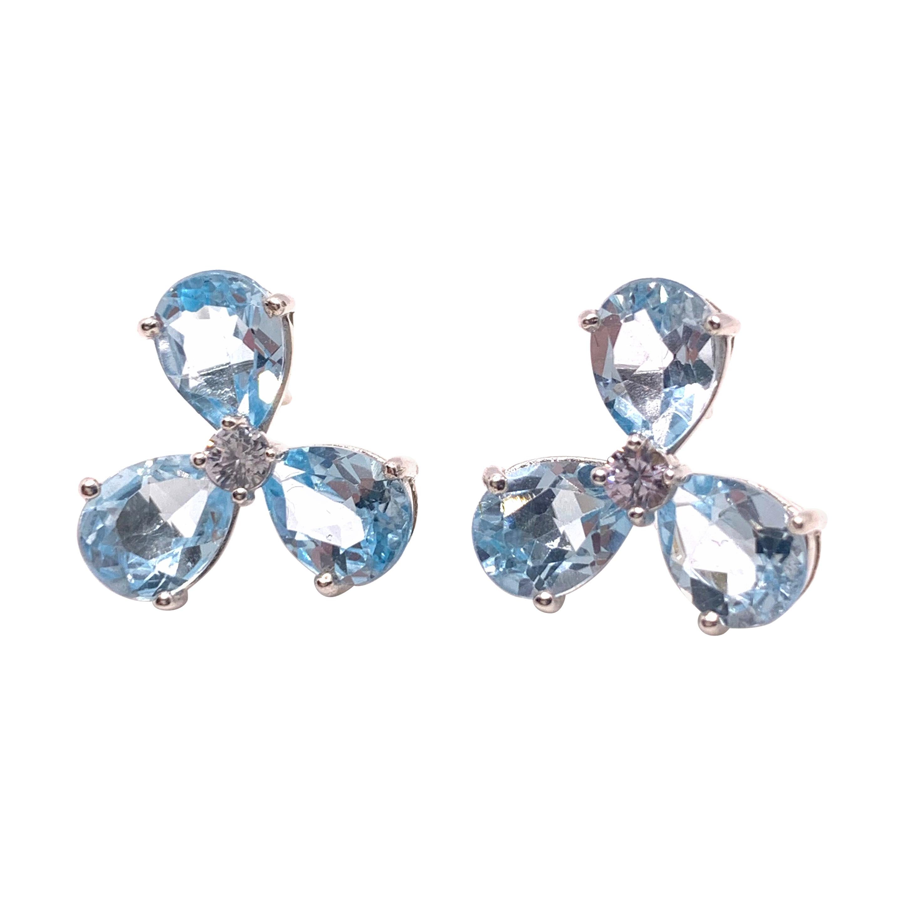 Stunning pair of Three-petal Genuine Blue Topaz Flower Earrings