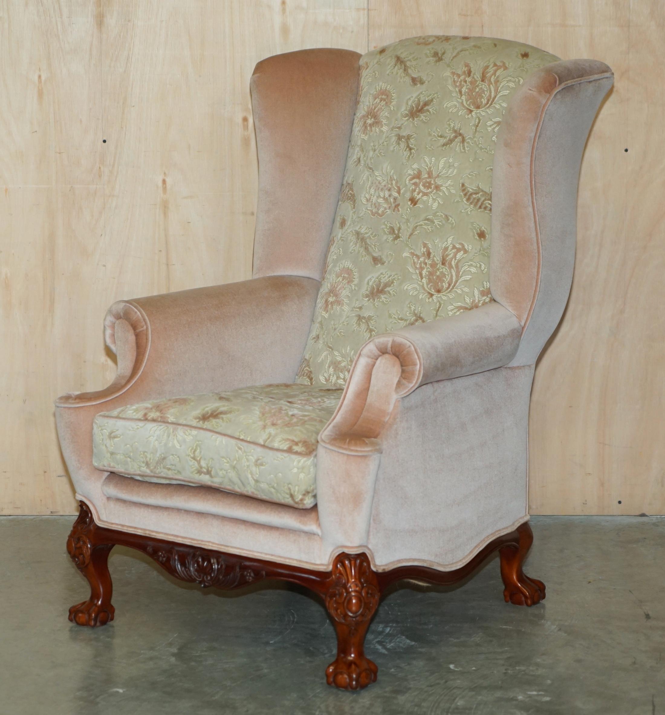 Royal House Antiques is delighted to offer for sale this lovely pair of Salmon pink and Floral upholstered Wingback armchairs with ornately carved Claw & Ball feet to the front and back 

This pair of armchairs are super decorative and very well