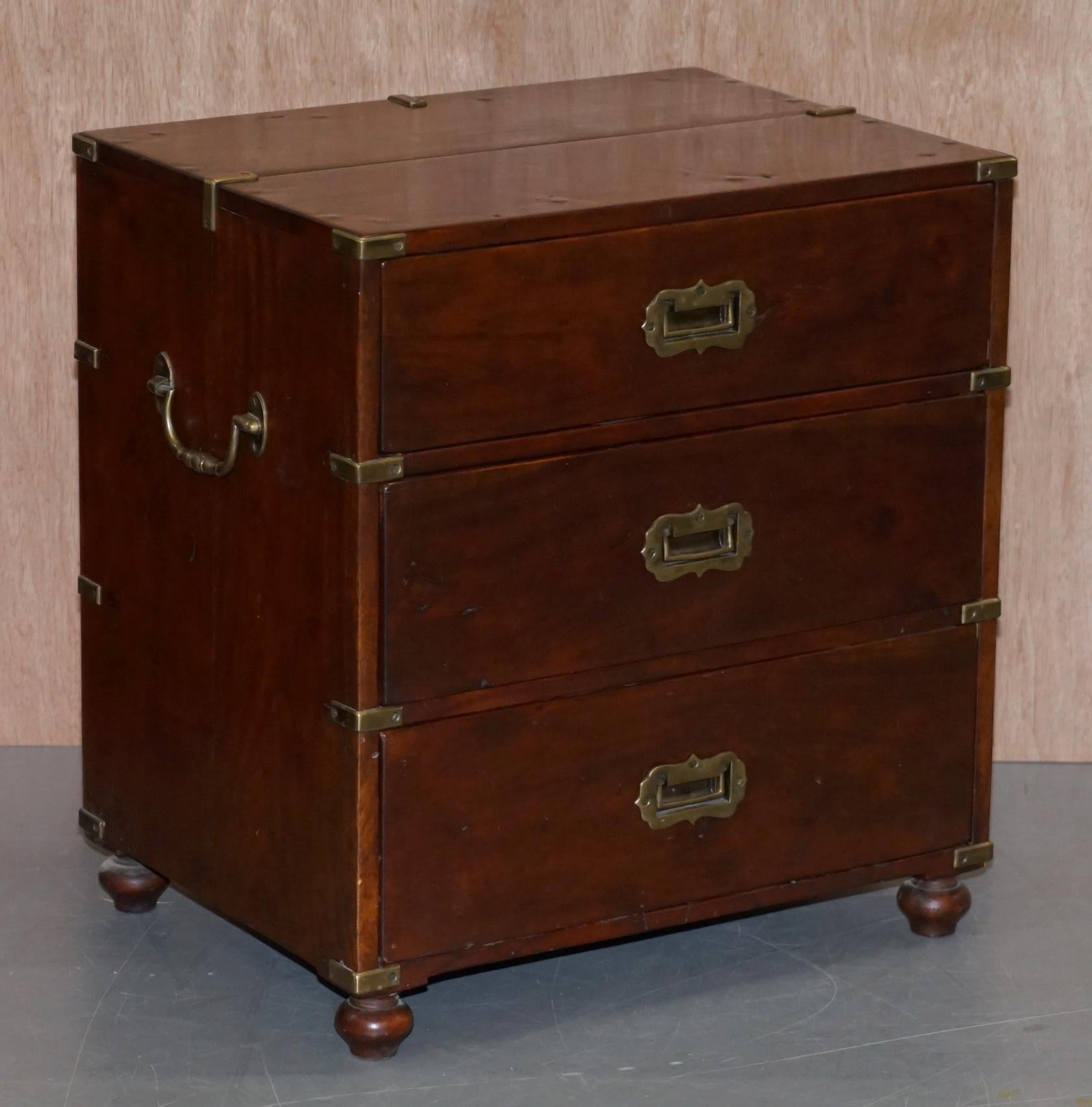 We are delighted to offer for sale this stunning pair of vintage solid wood with oversized stud work Anglo-Indian Campaign drawers

A very good looking well-made and substantial pair of drawers, they are bedside or lamp end wine table sized, very