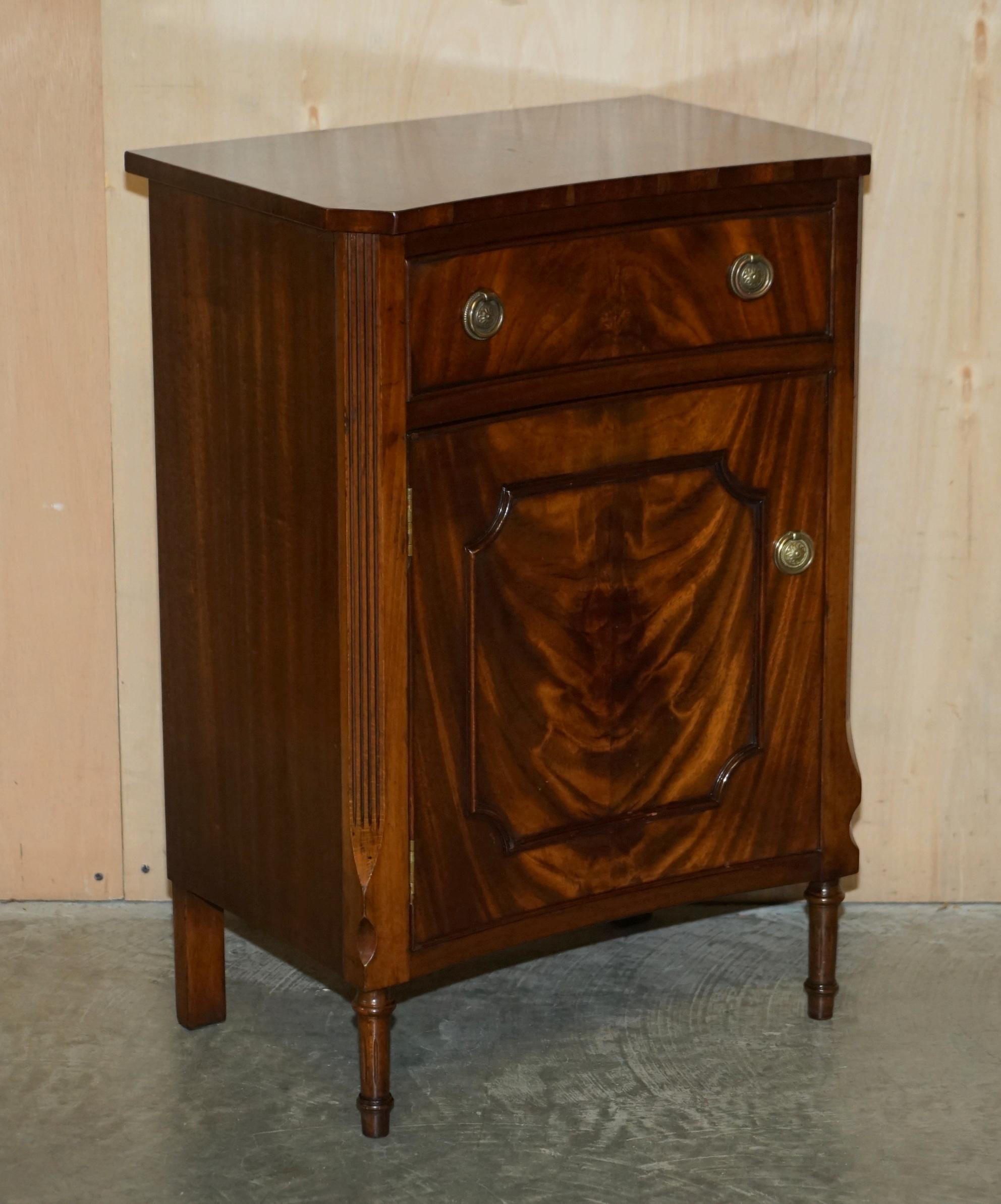 We are delighted to offer for sale this sublime pair of vintage Flamed Mahogany bow fronted side end tables with single drawers.

A truly stunning and well made pair, the timber is flamed mahogany, it has a wonderful patina and really glows in the