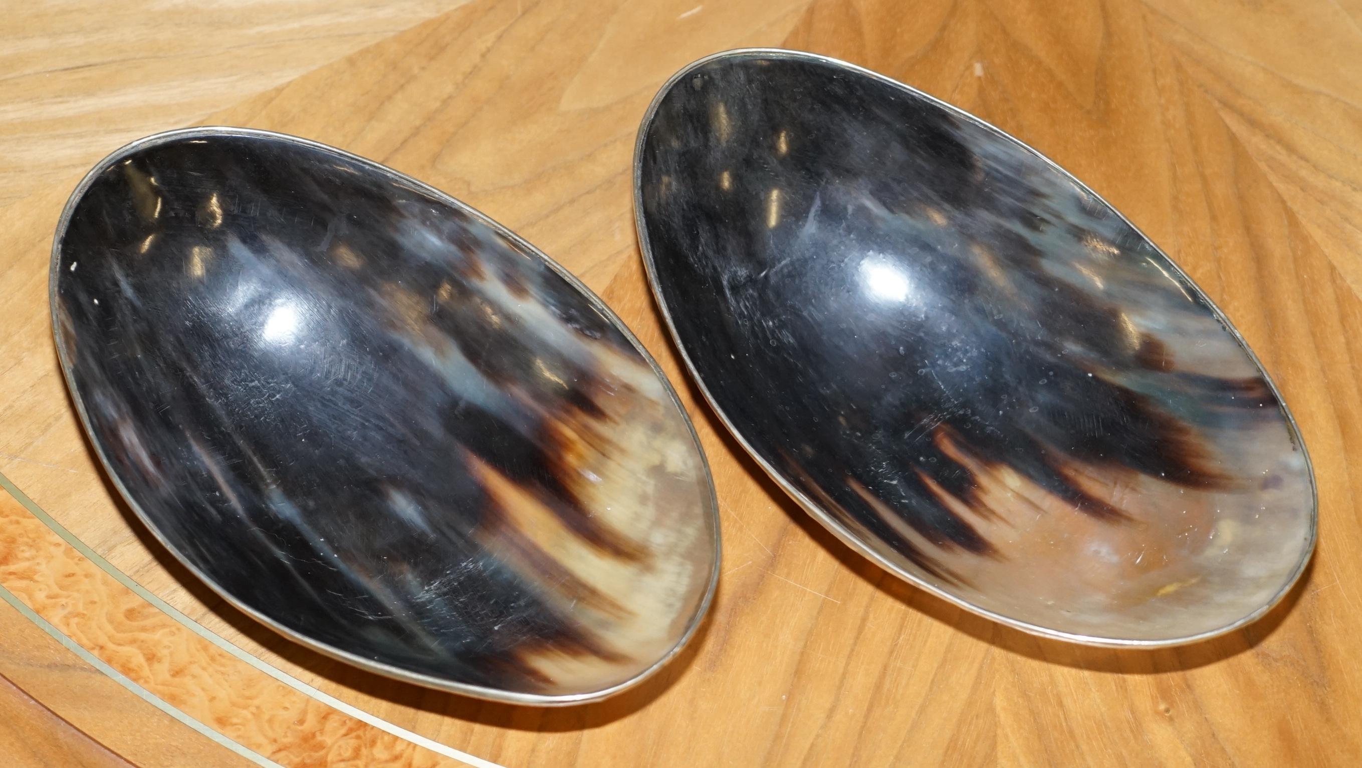 We are delighted to offer for sale this lovely pair of Horn bowls with silver trim

Very nice decorative and well made pair, the silver trim looks to be sterling silver

They are both in good order, there is minor wear to base of