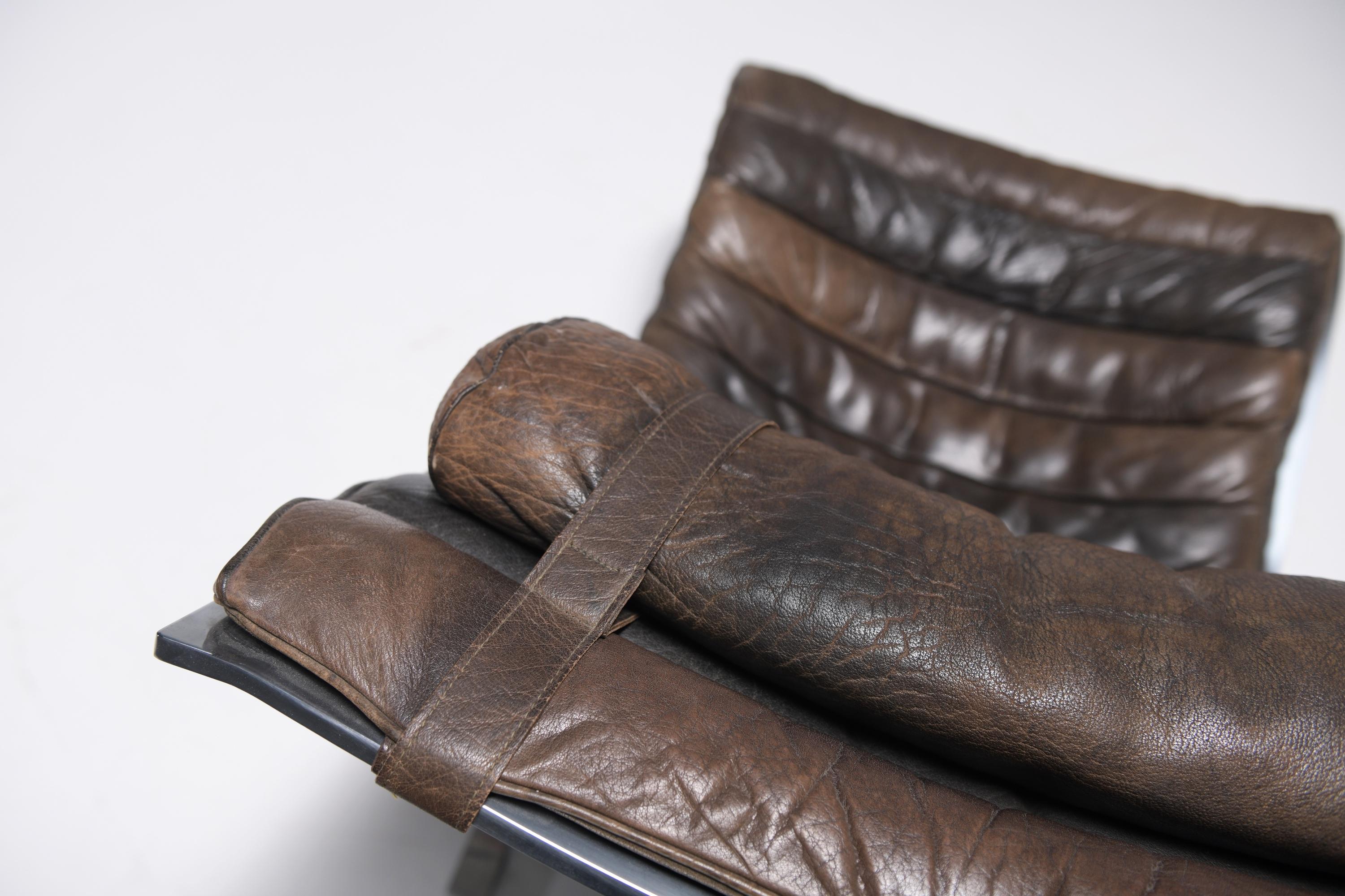 Stunning patinated ARI lounge chair in brown leather by Arne Norell - Möbel AB For Sale 1