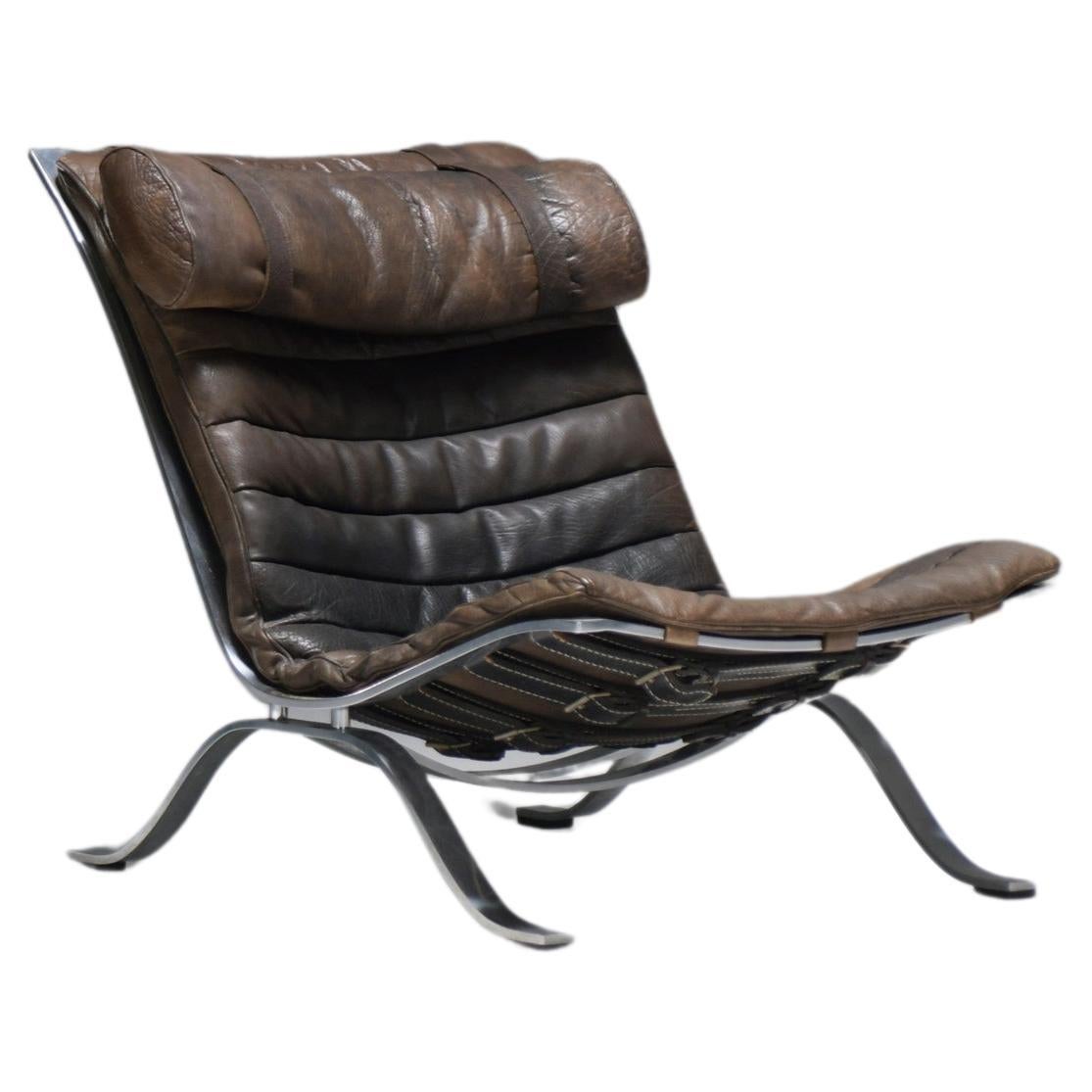 Stunning patinated ARI lounge chair in brown leather by Arne Norell - Möbel AB For Sale
